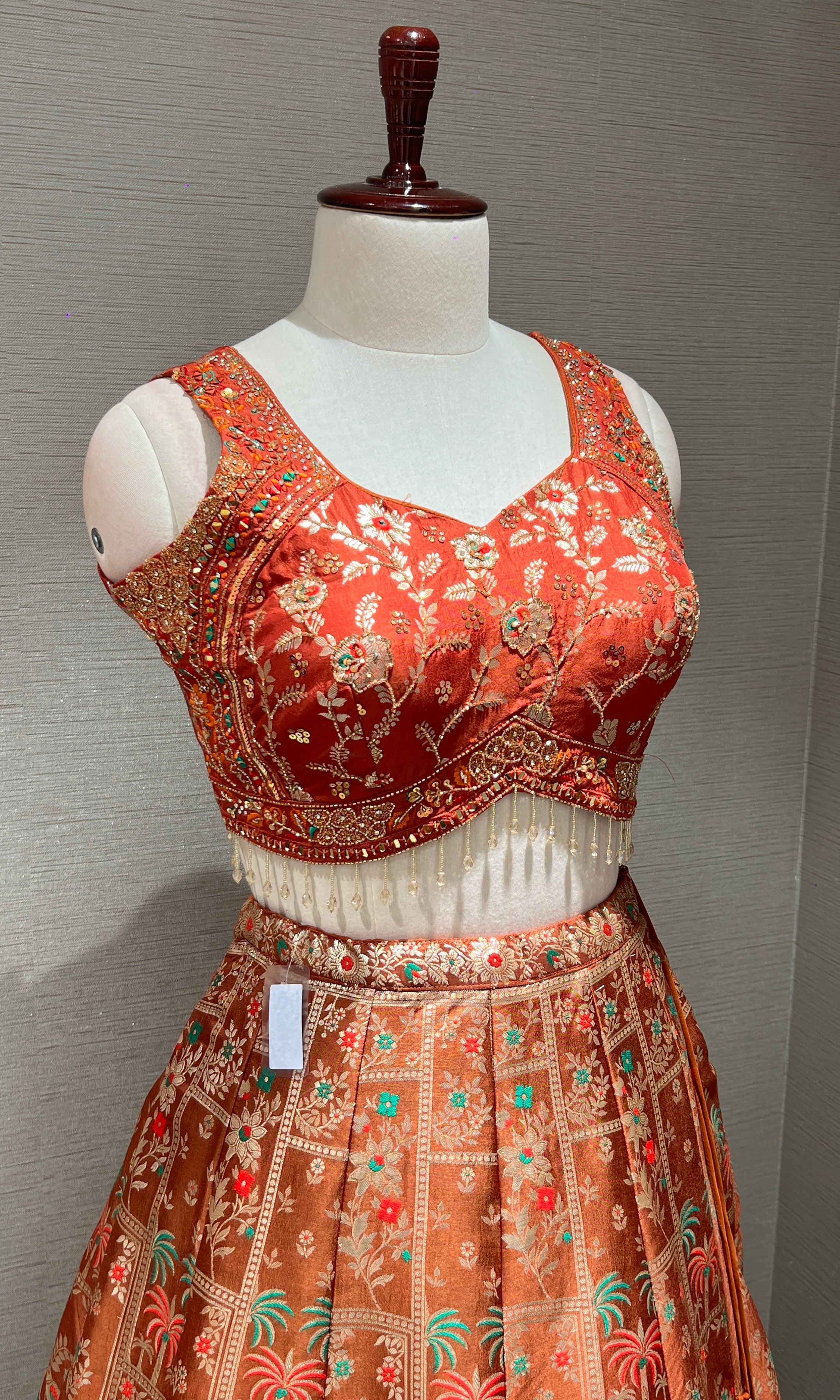 Rust orange Lehenga with Floral and Peacock embroidery