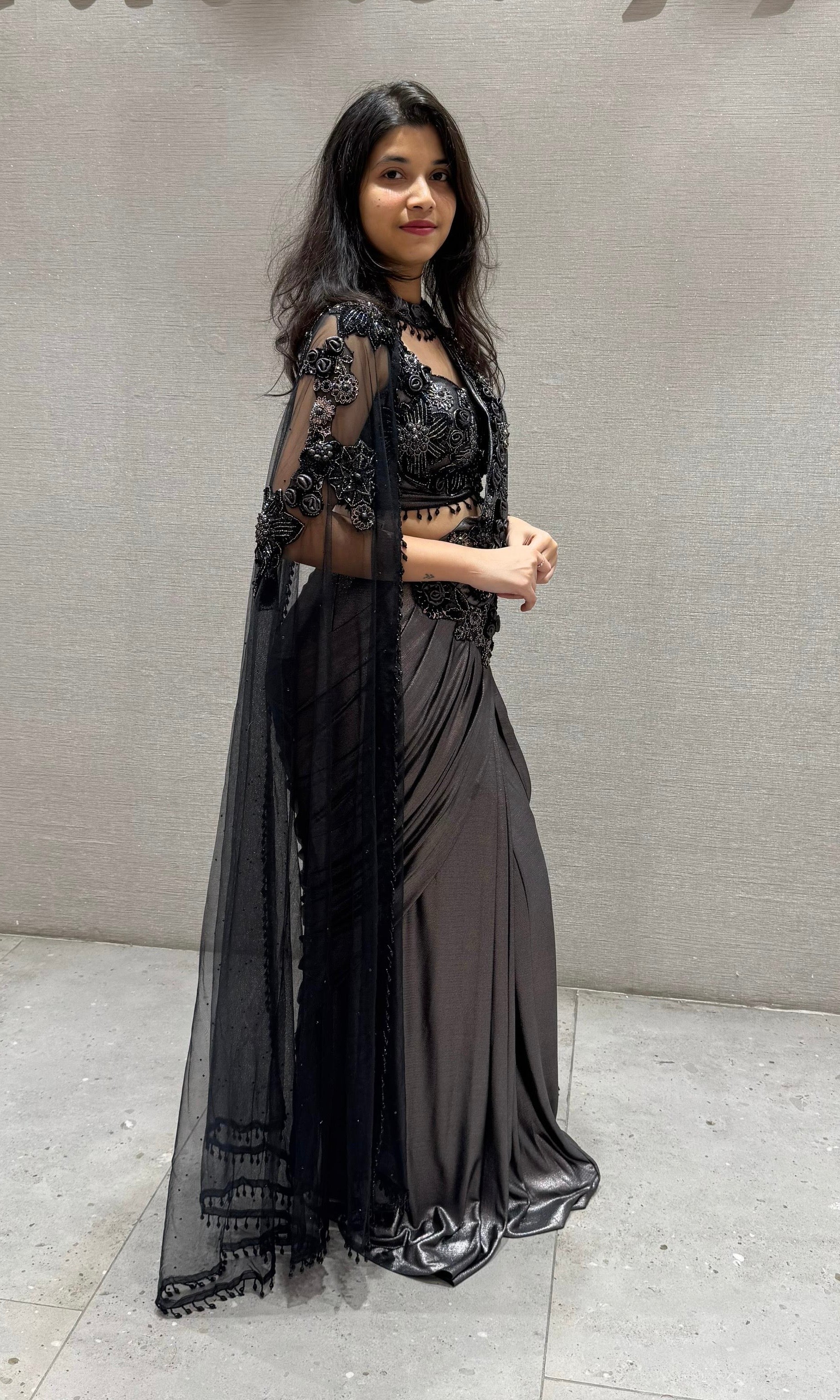 Black sequin drape saree with sheer cape