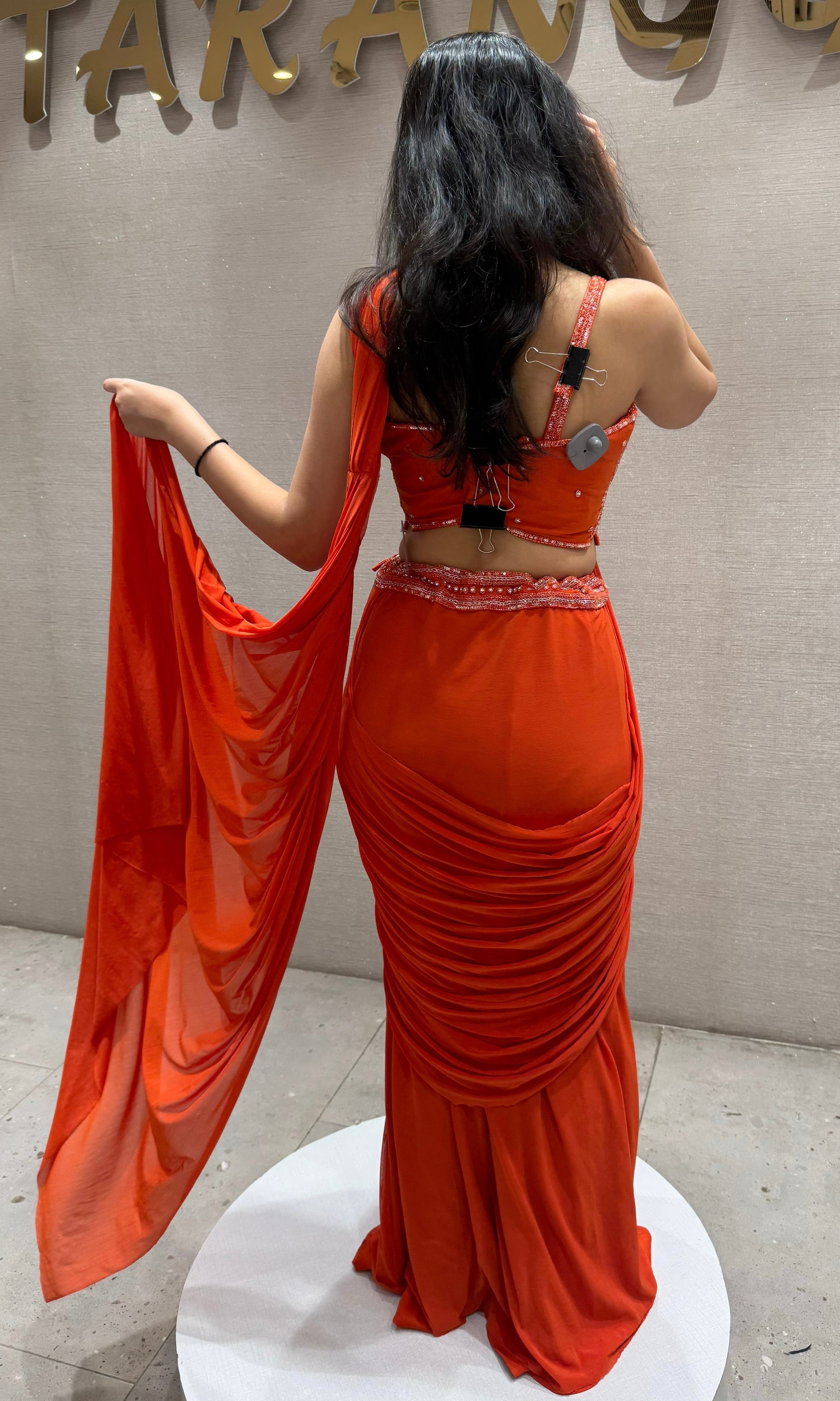 Orange drape saree with Corset Blouse