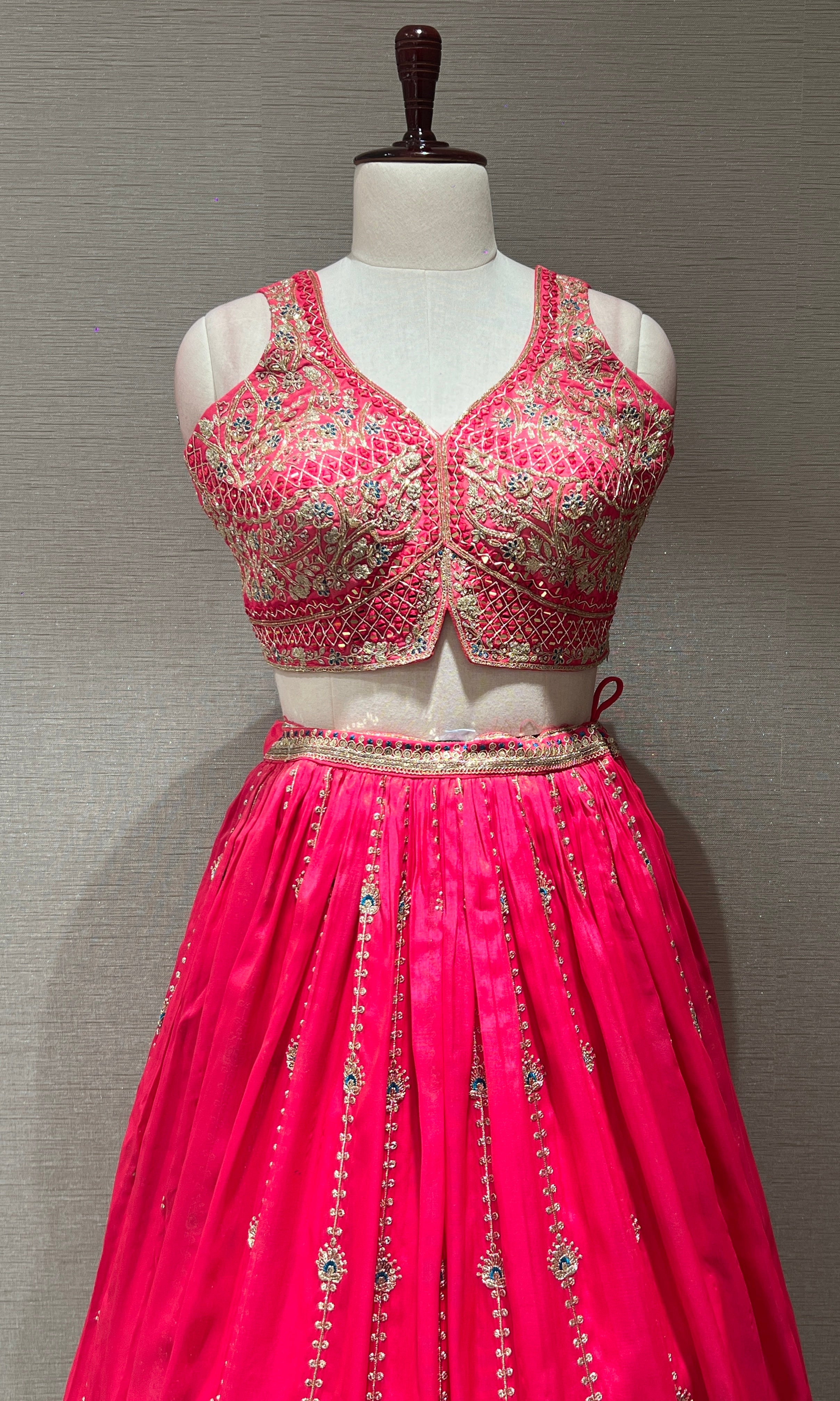 rani pink lehenga with intricate embroidery
