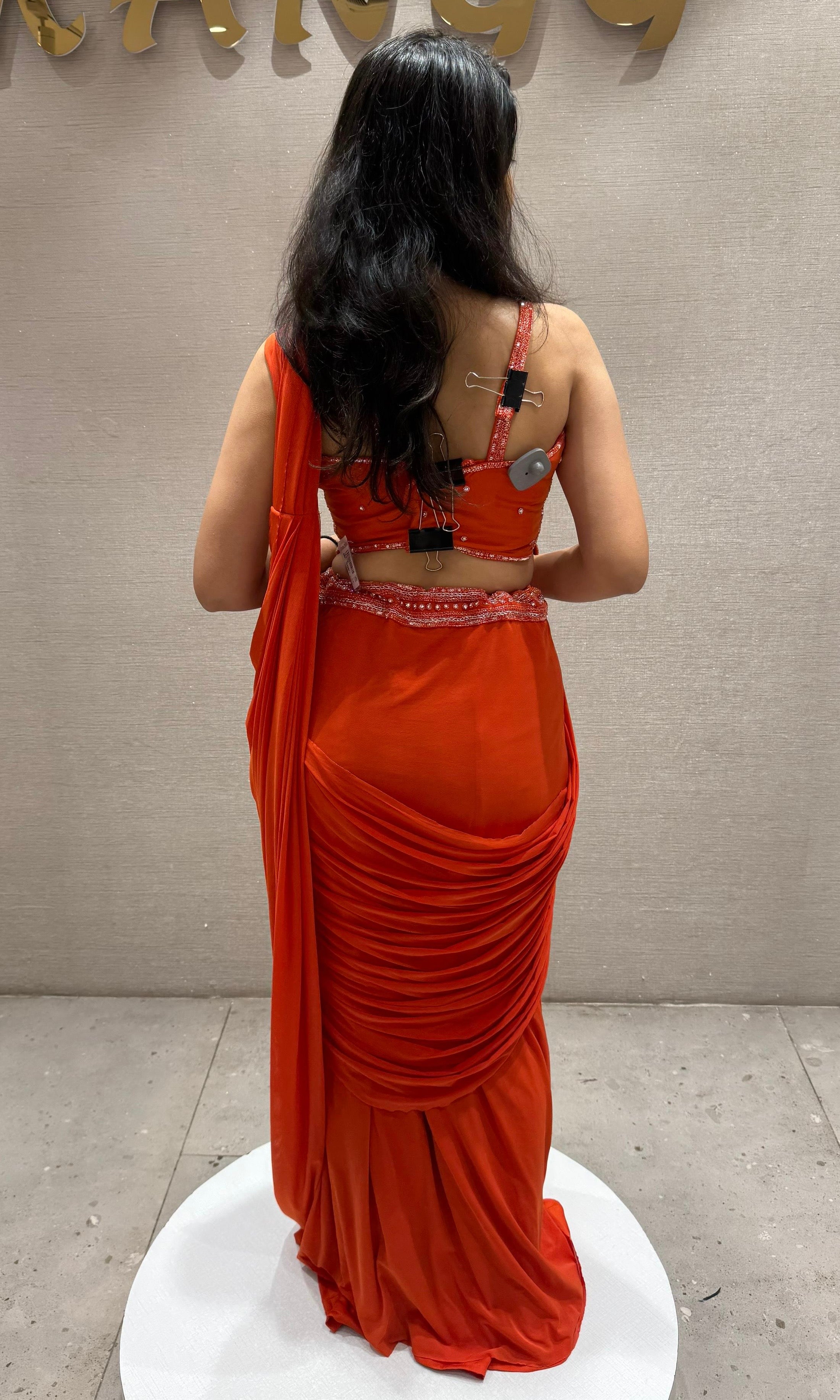 Orange drape saree with Corset Blouse