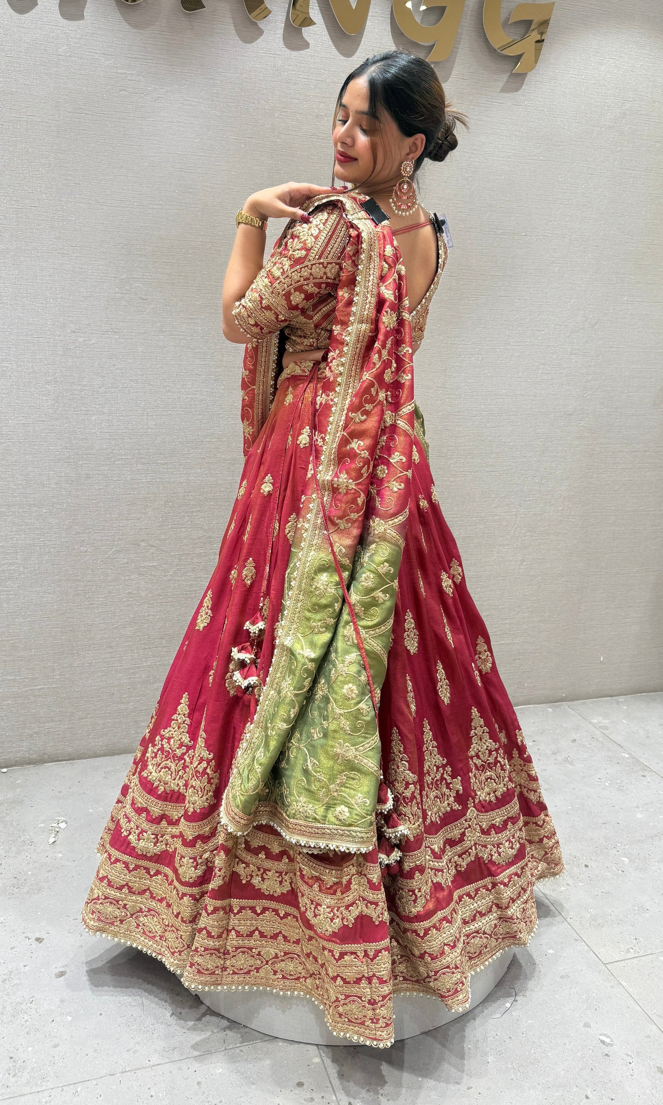 Brick red and green Lehenga with potli
