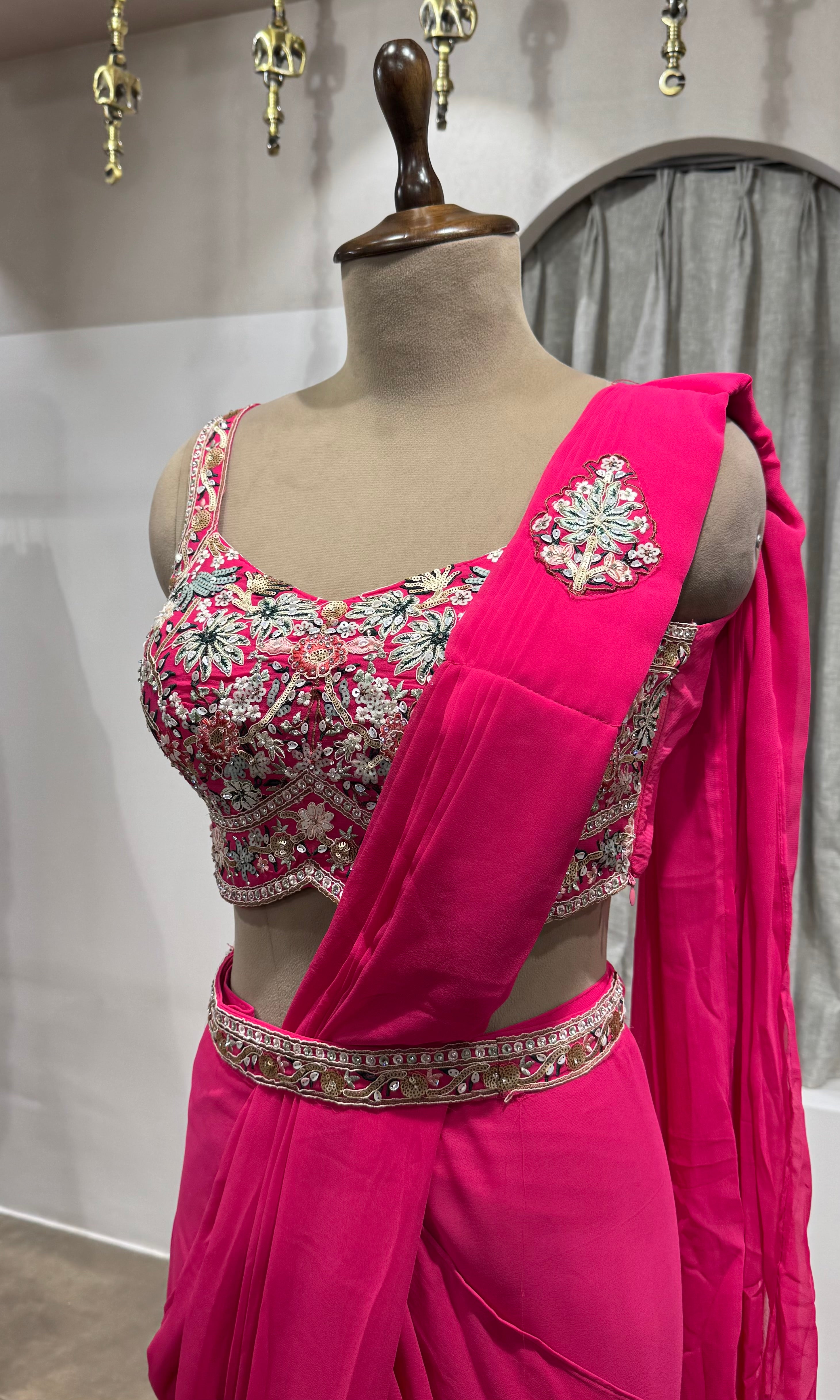 Pink drape saree with floral blouse & belt