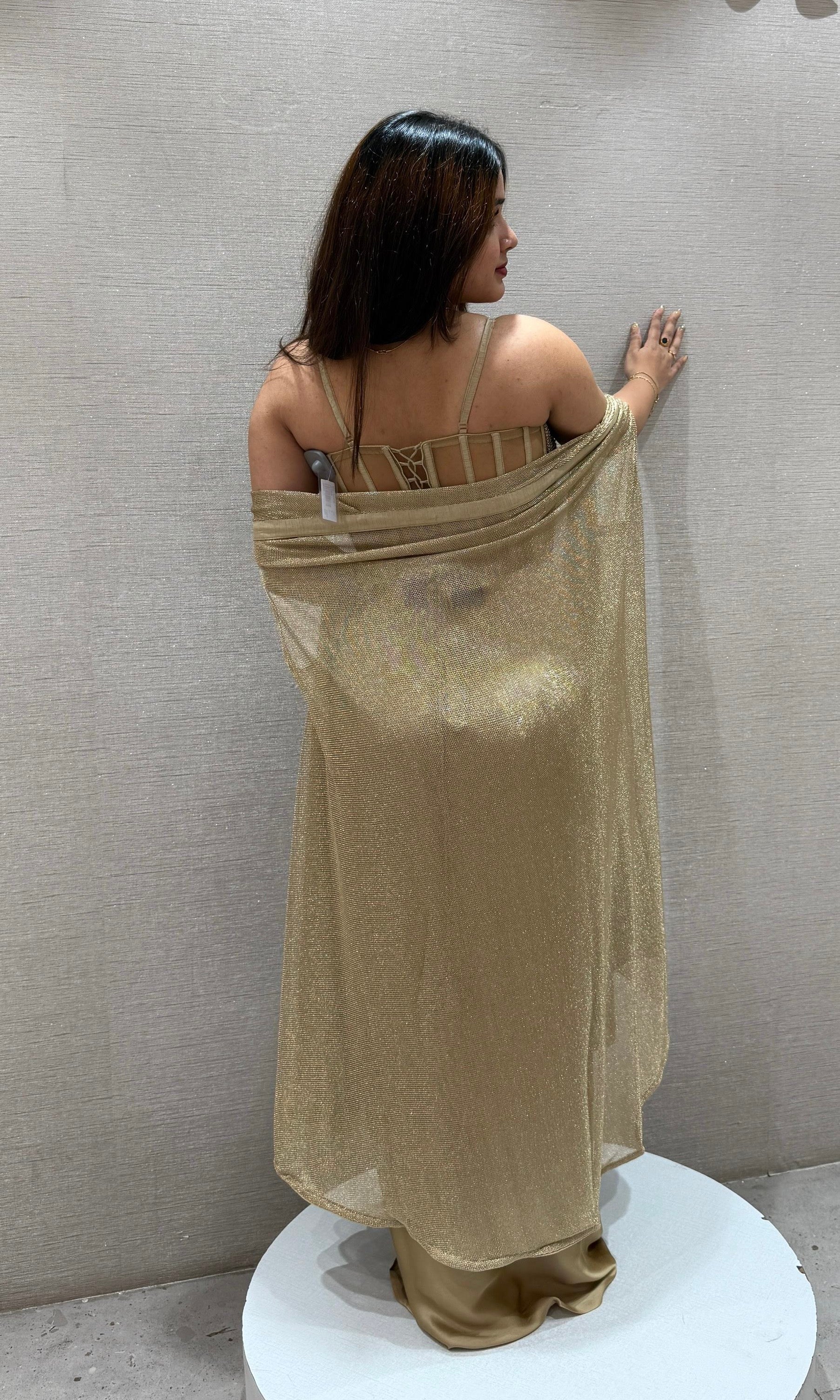 Golden sequined crop top with dhoti skirt and cape