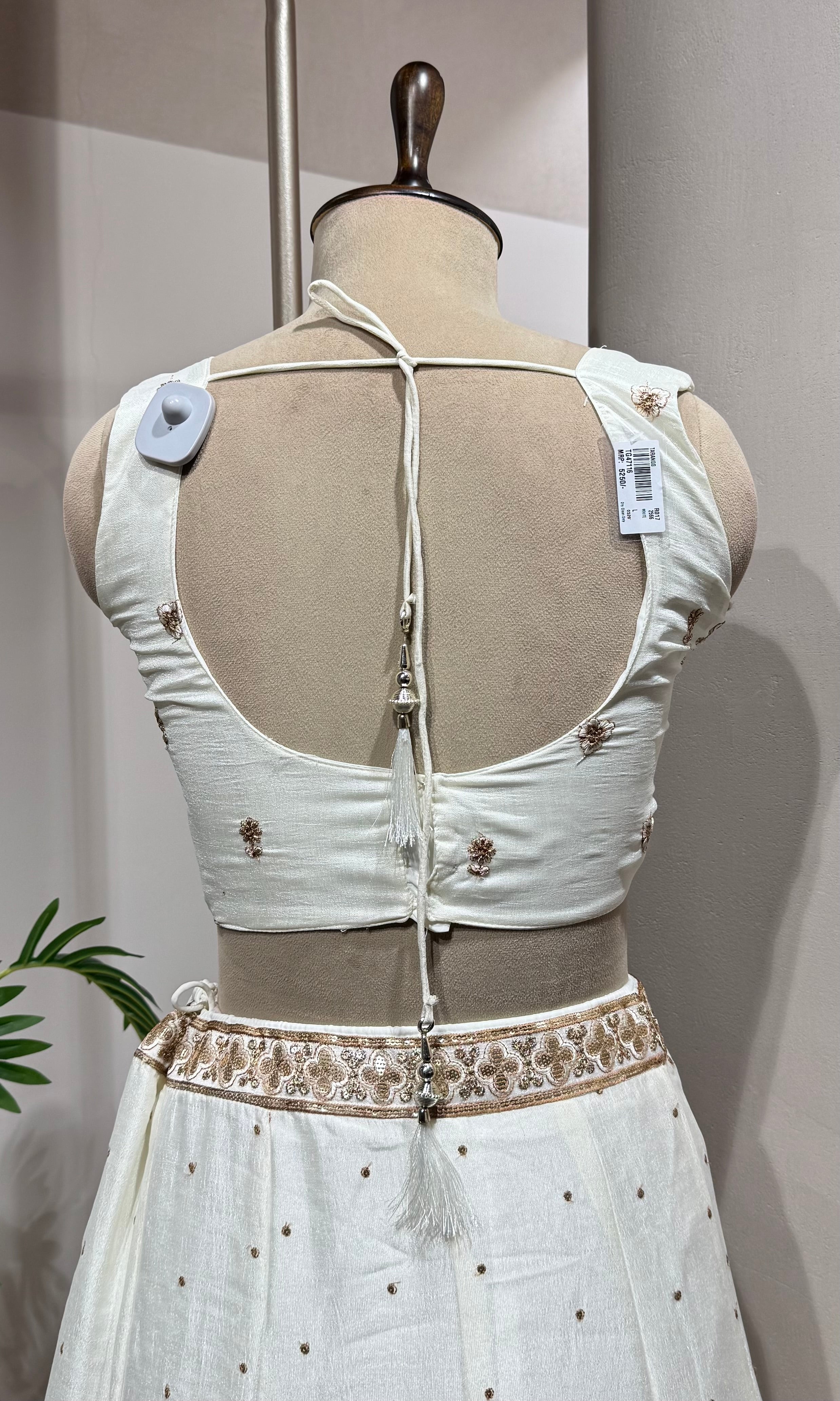 White Lehenga with gold embellished blouse