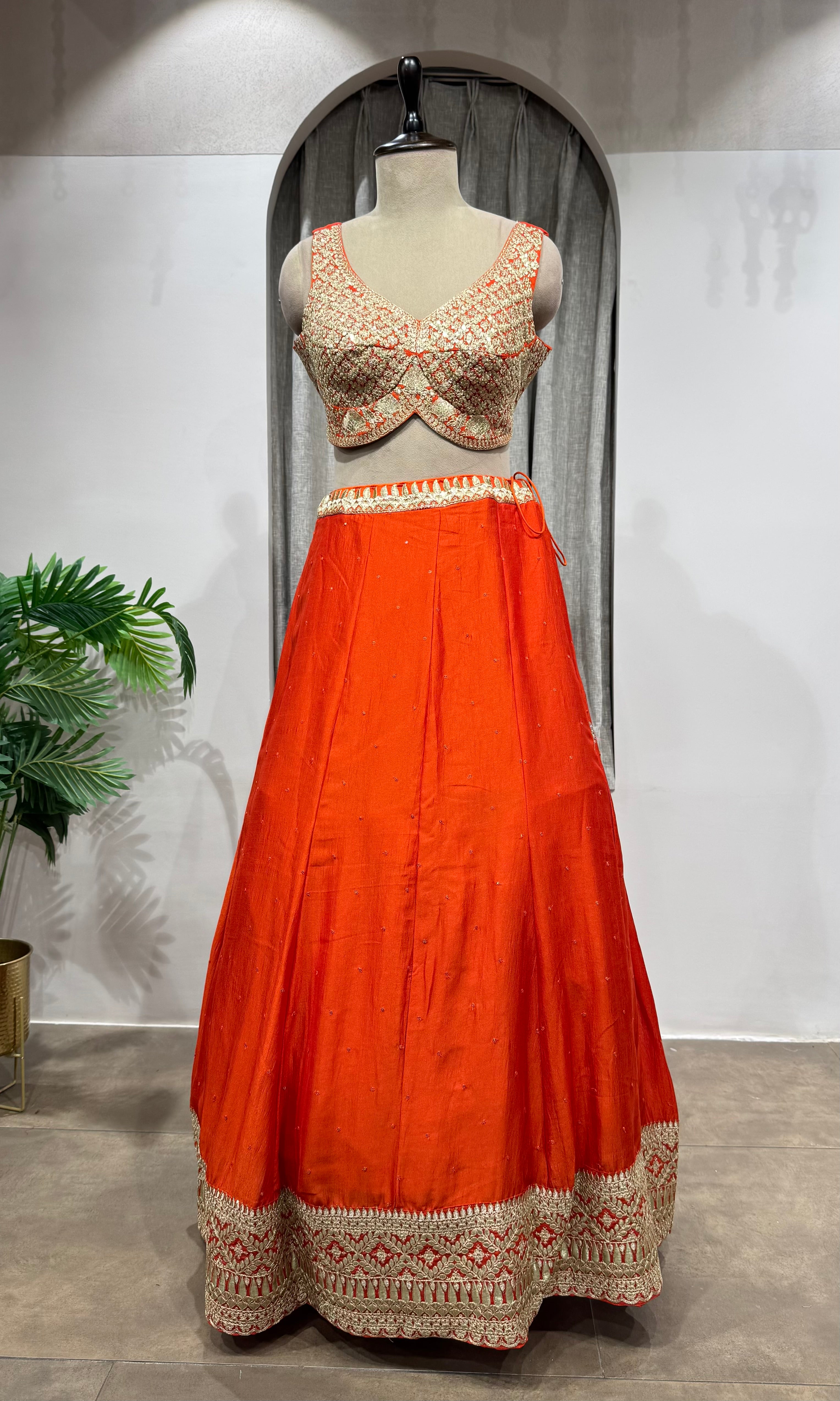 ORANGE LEHENGA WITH GOLDEN EMBROIDERY