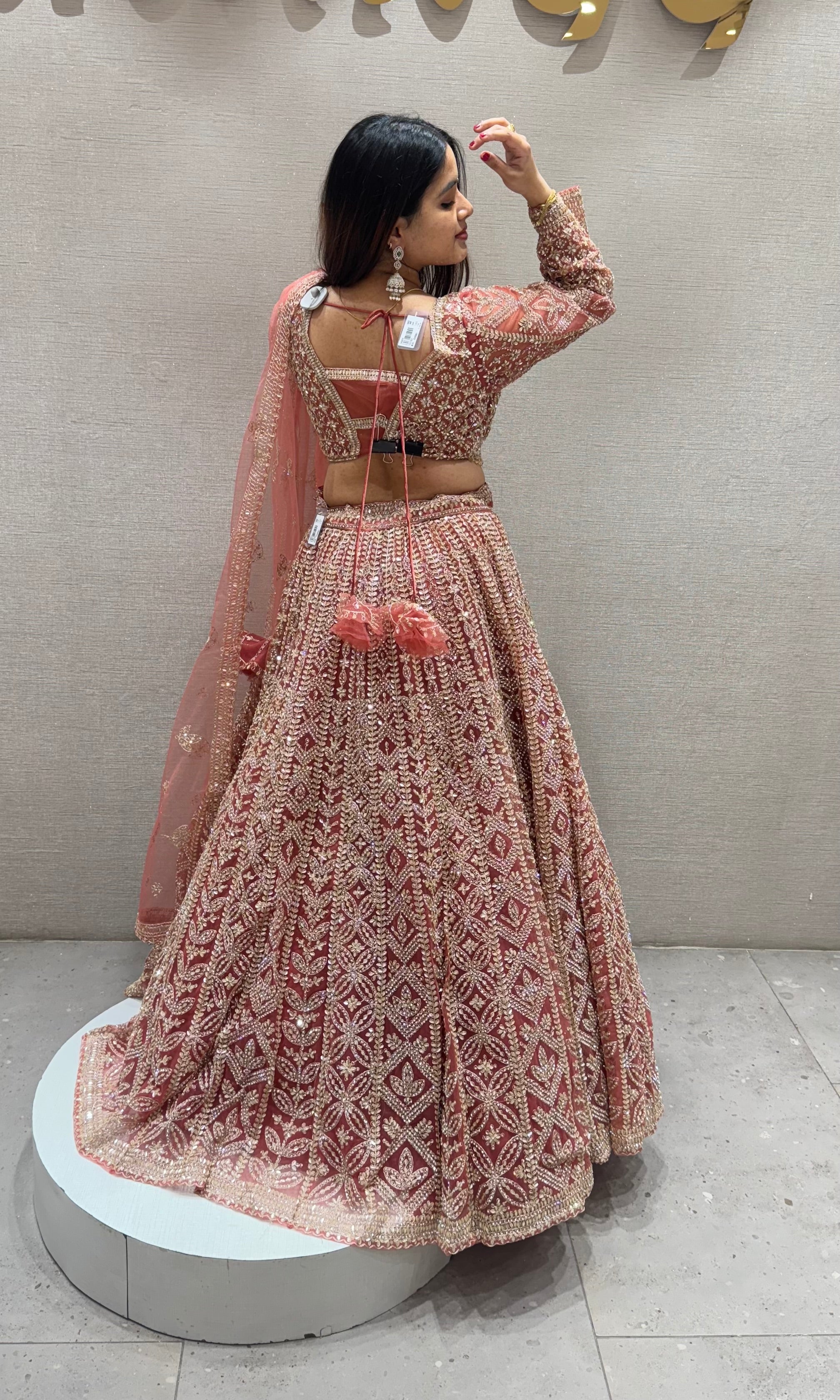 Peachy Orange lehenga with stone work