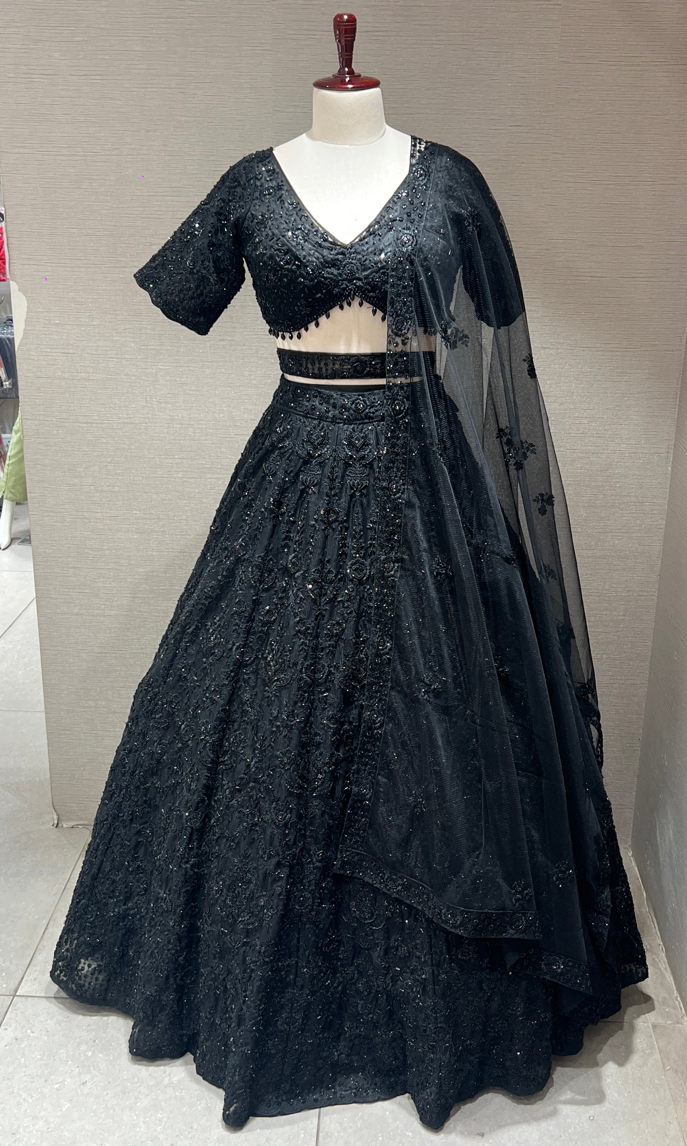 Black lehenga with pretty blouse and netted dupatta