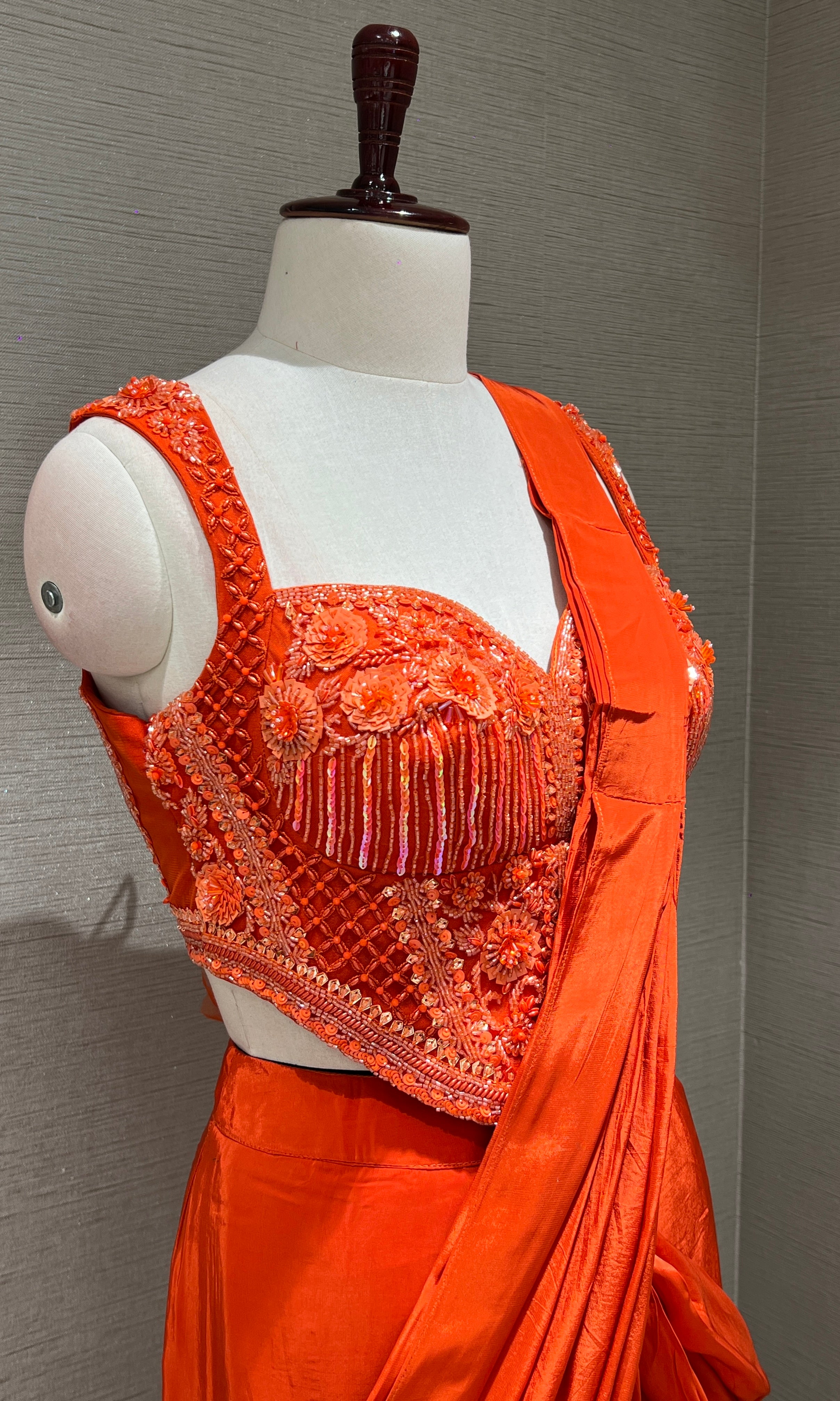 Orange drape saree with corset blouse