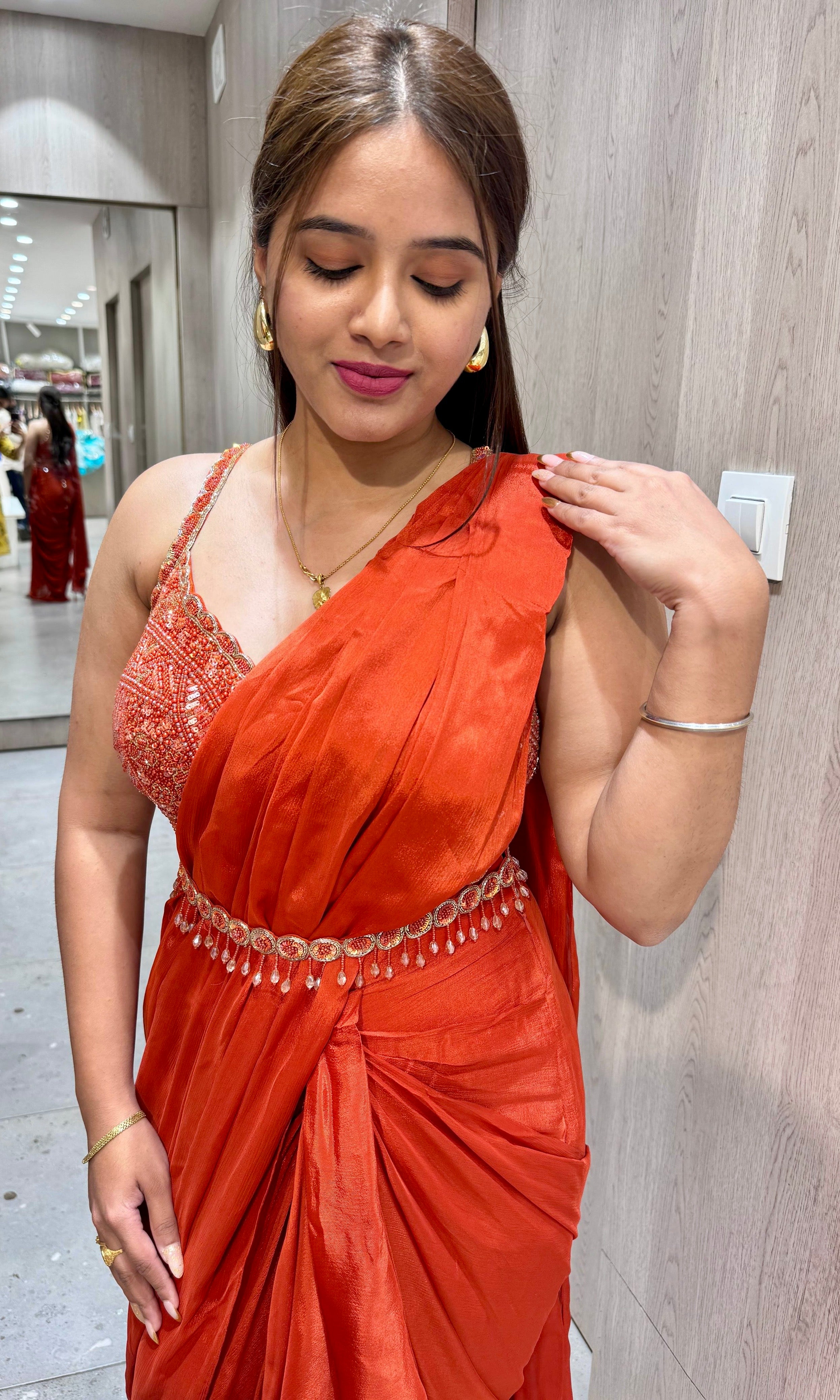 rust orange drape ruffled saree with blouse and belt