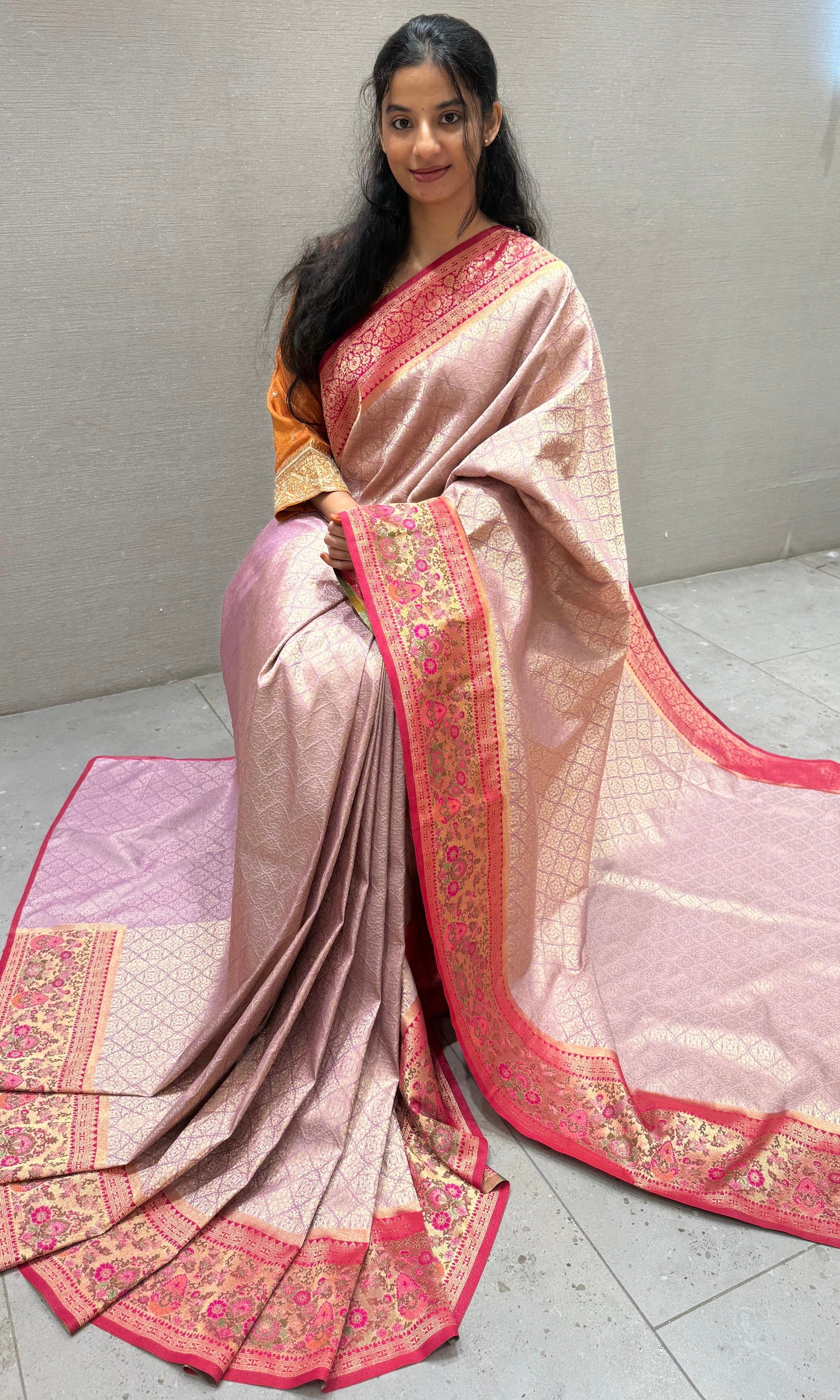 Pink saree with embroidered ready blouse
