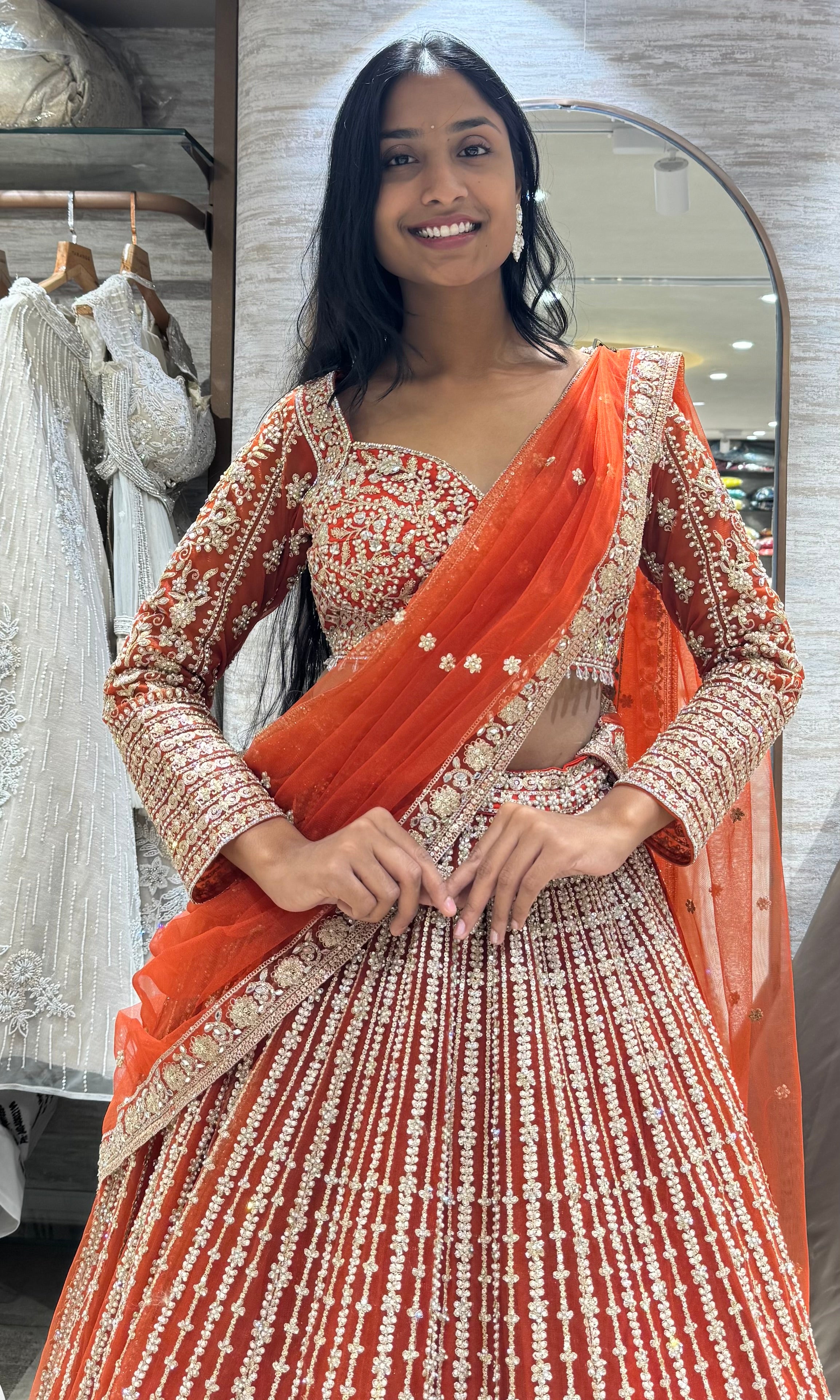 rust and white intricate embroidery lehenga
