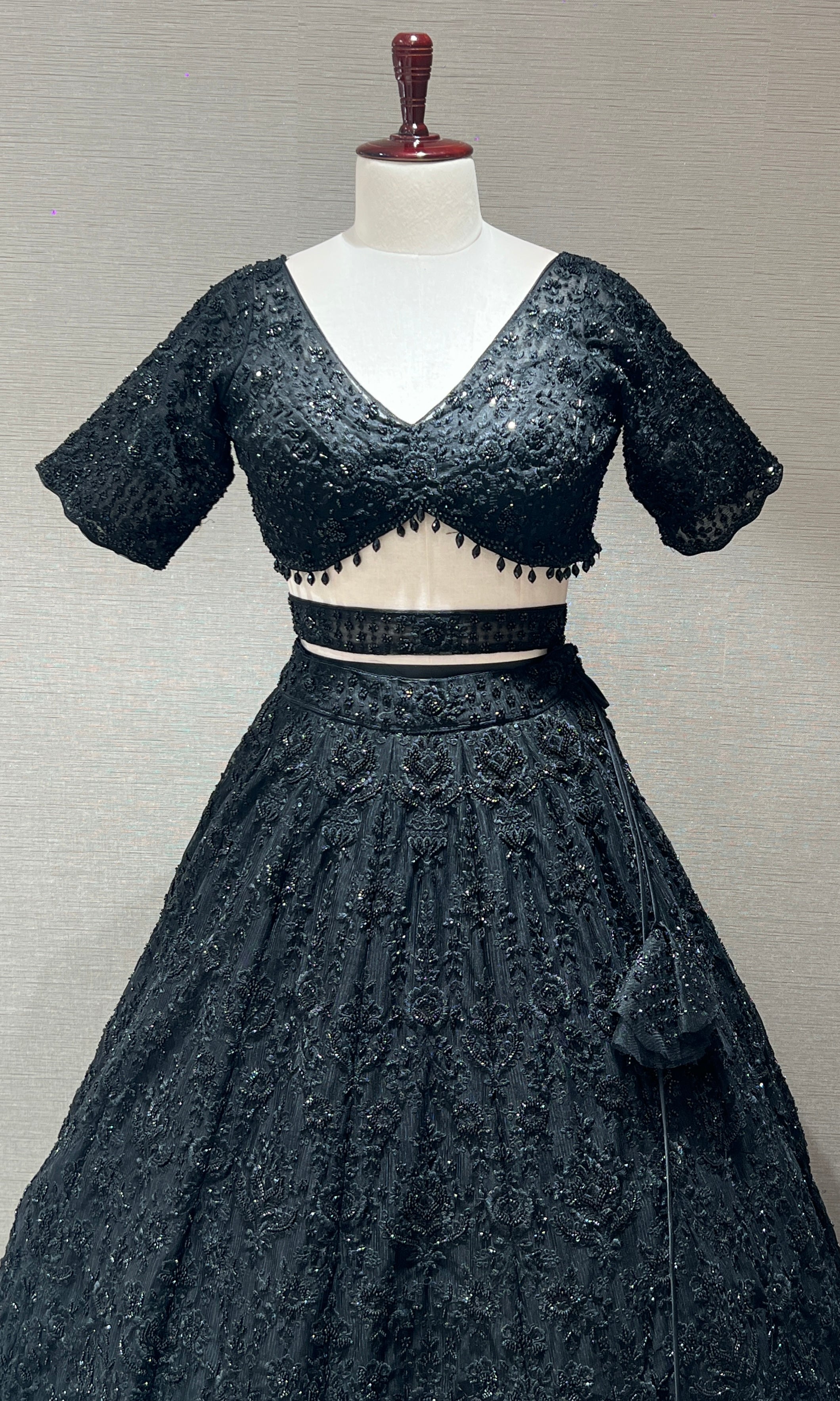 Black lehenga with pretty blouse and netted dupatta