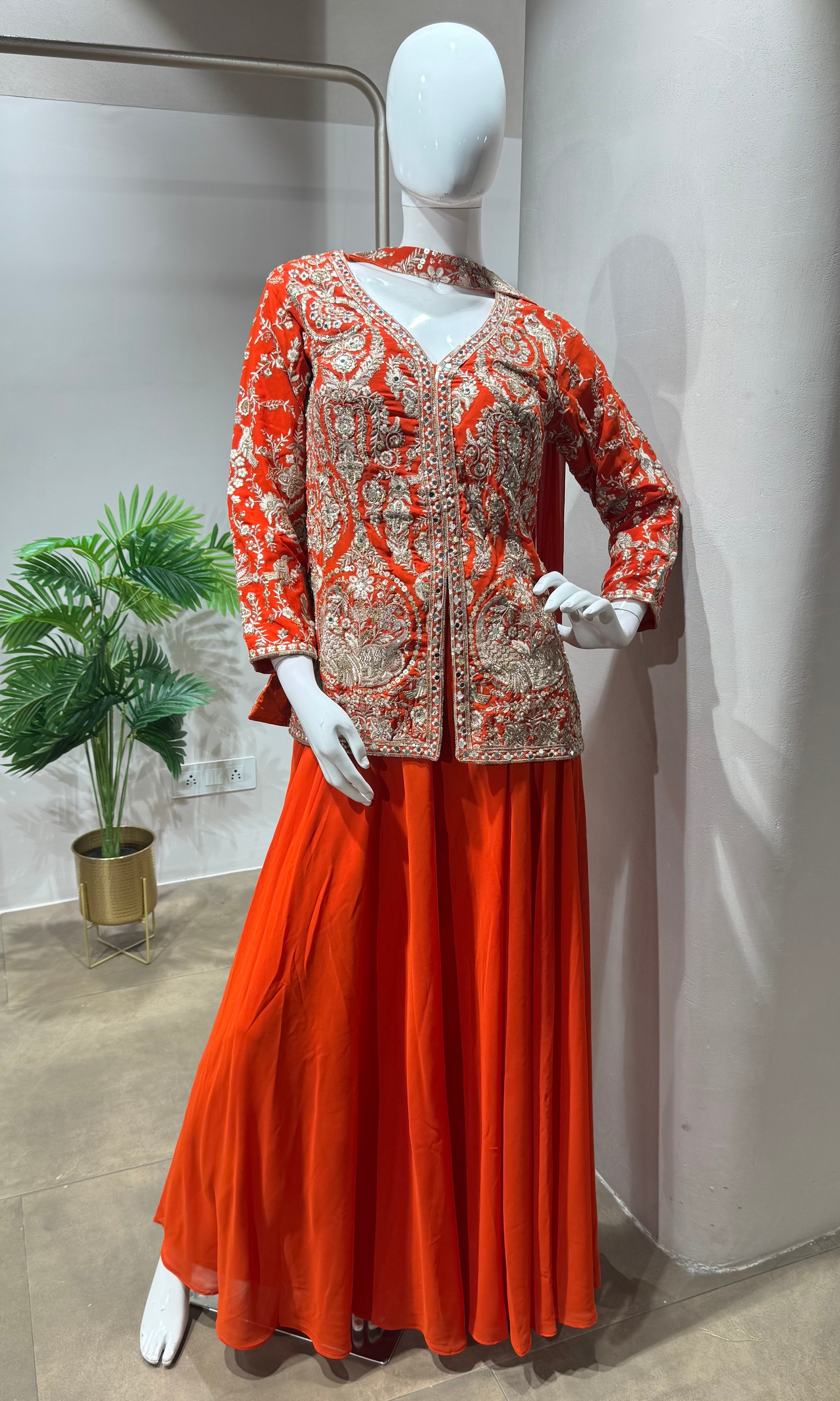 orange and gold embroidered sharara set