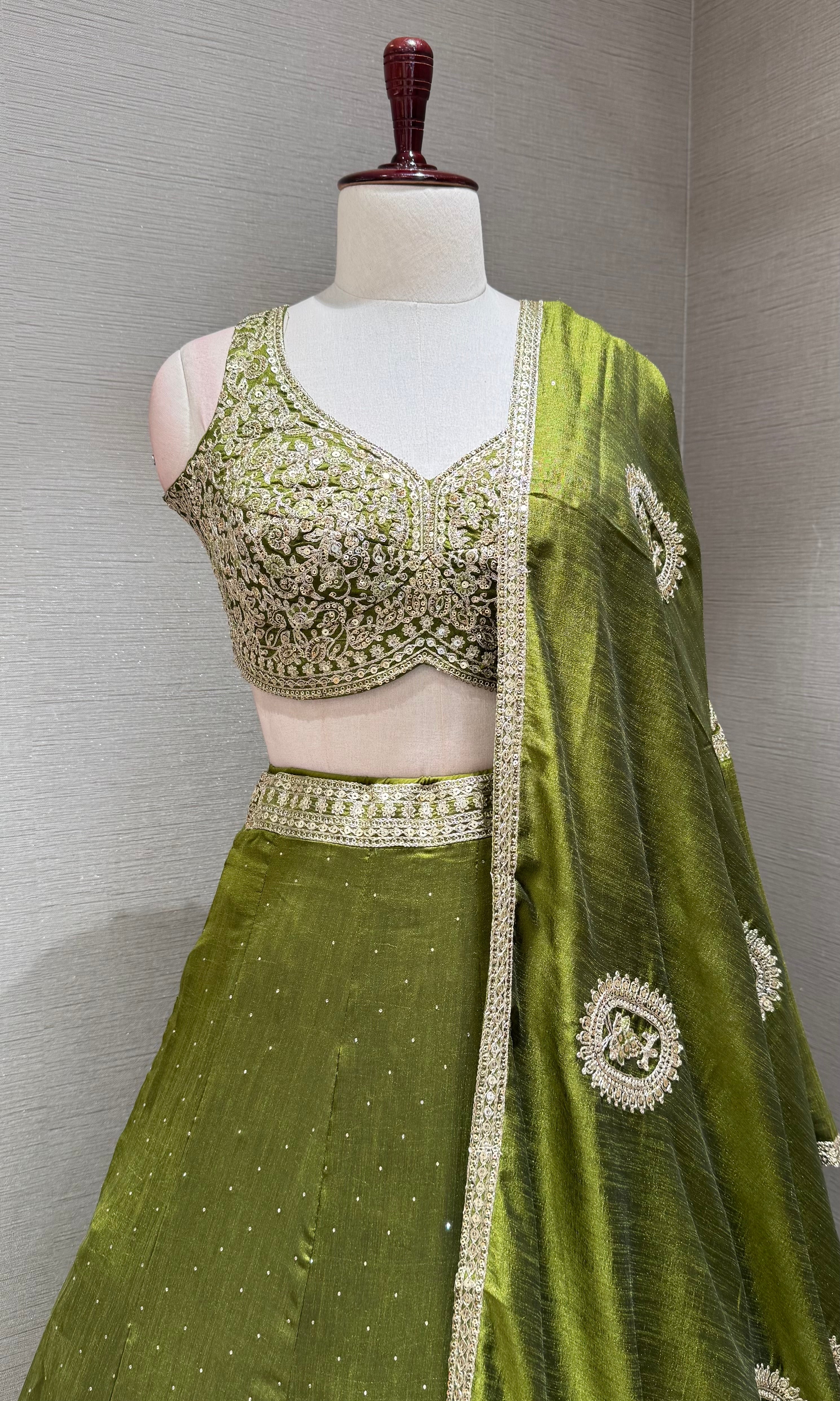 Green Lehenga Choli with Intricate Gold Embroidery