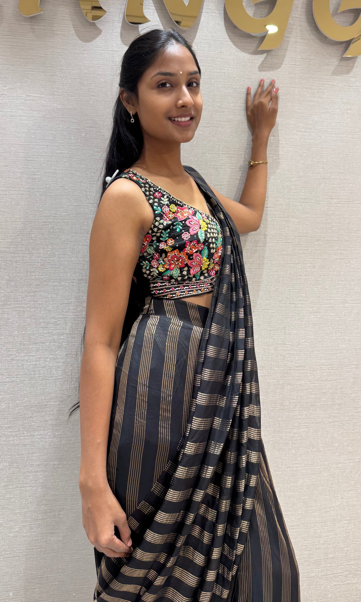 Black and silver striped drape saree with intricate blouse