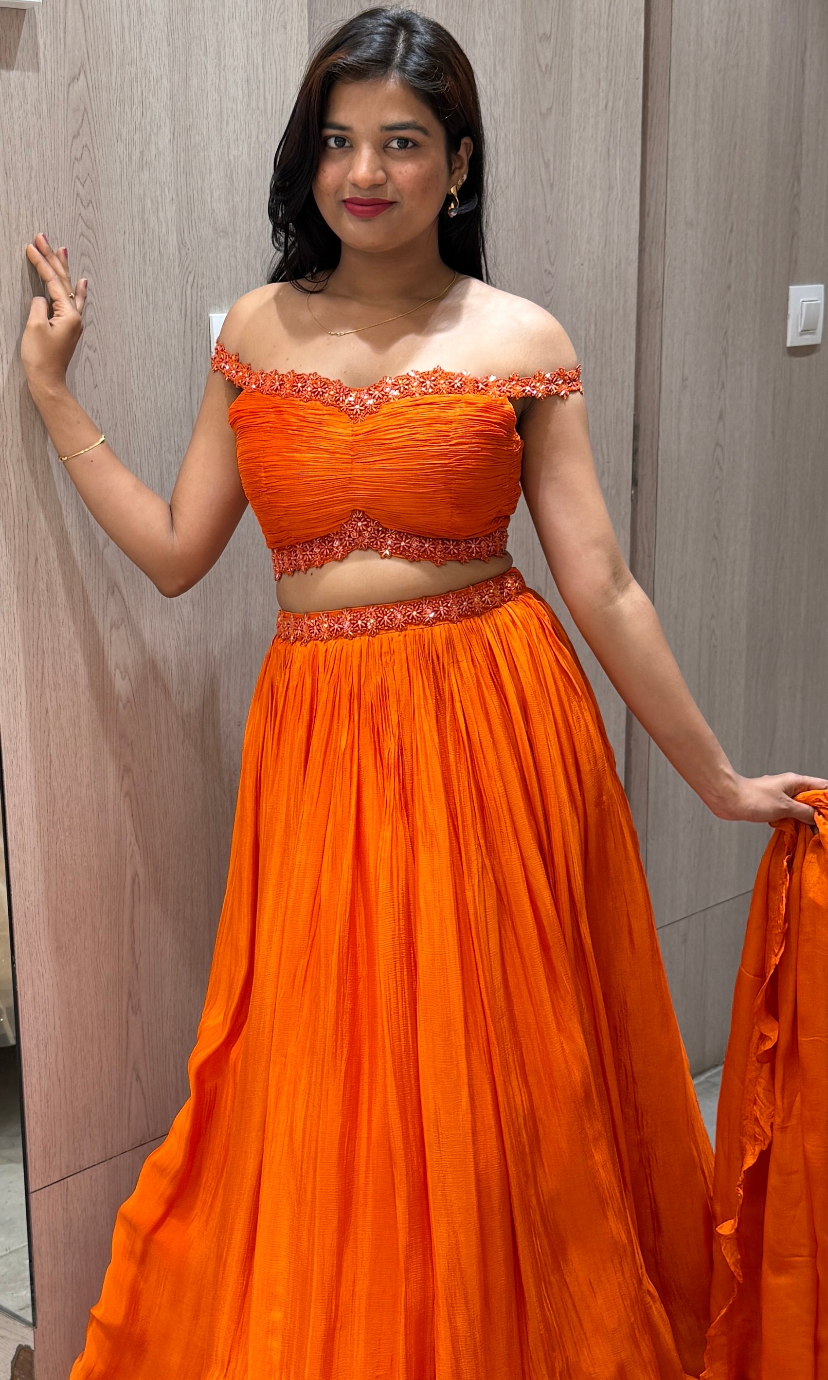 Orange lehenga with cold shoulder blouse 1000