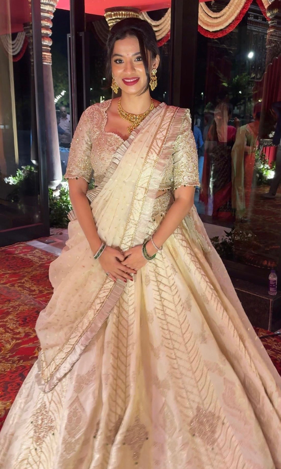 Ivory white gold lehenga with emerald greed beads