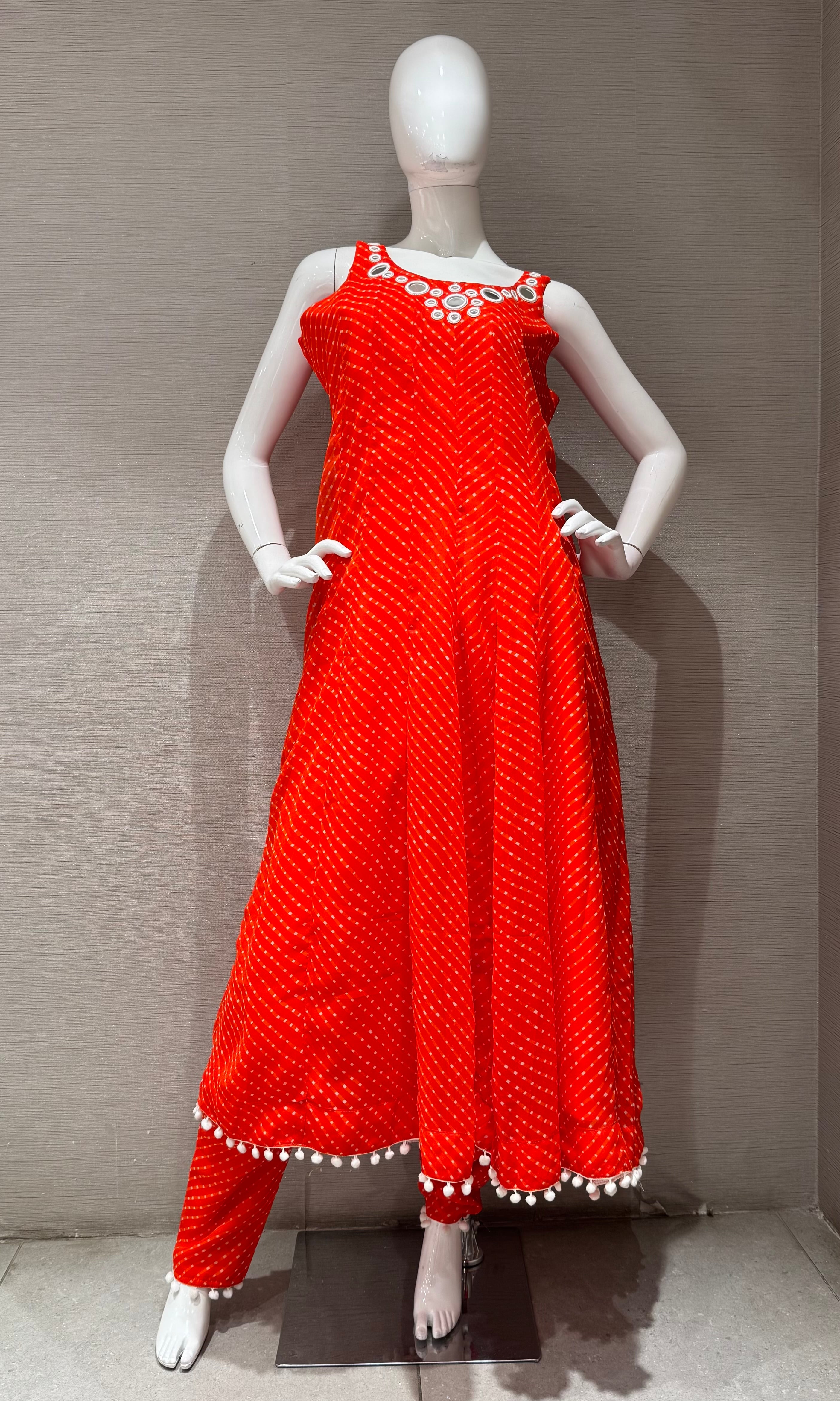 Orange bandhani print and intricate mirror anarkali set