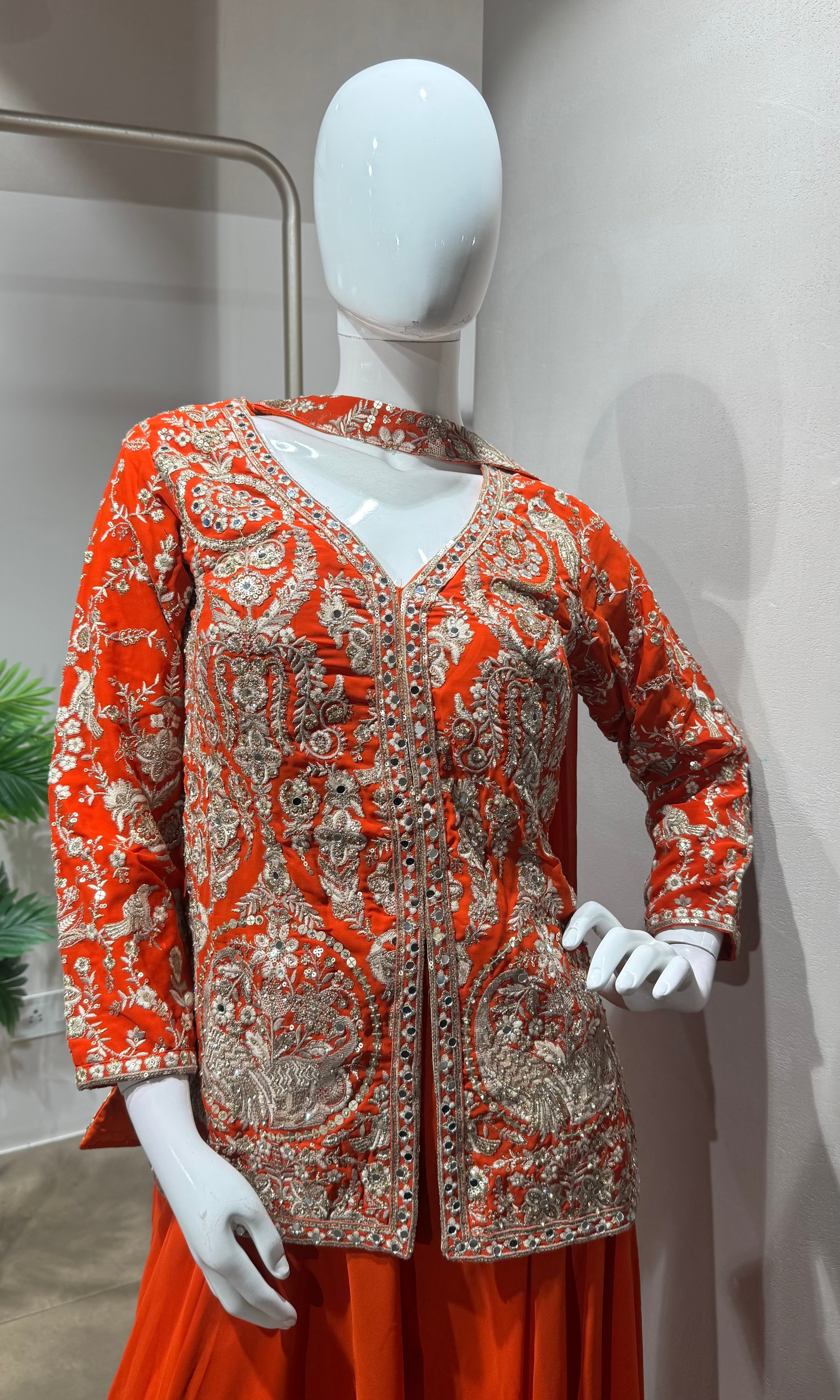 orange and gold embroidered sharara set