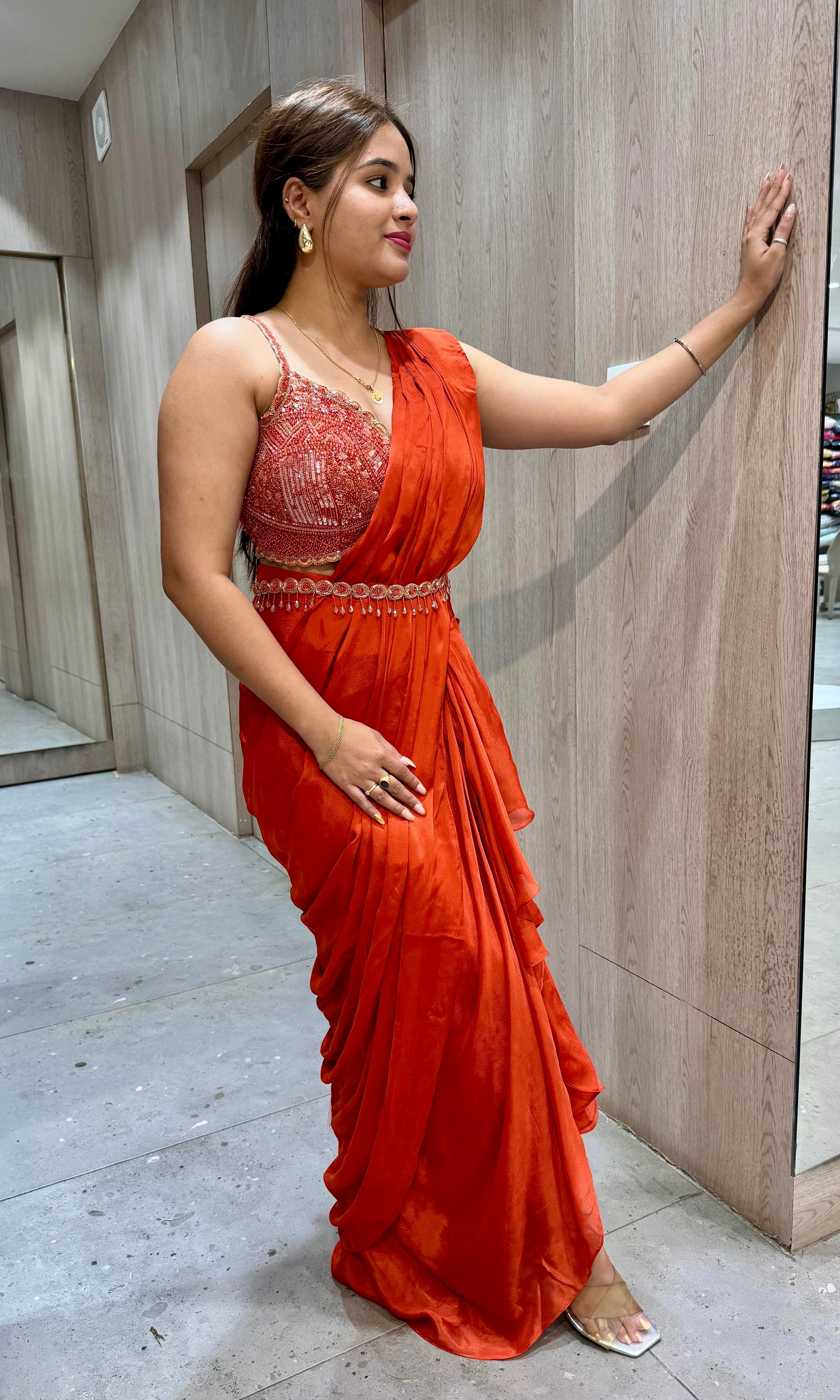 rust orange drape ruffled saree with blouse and belt