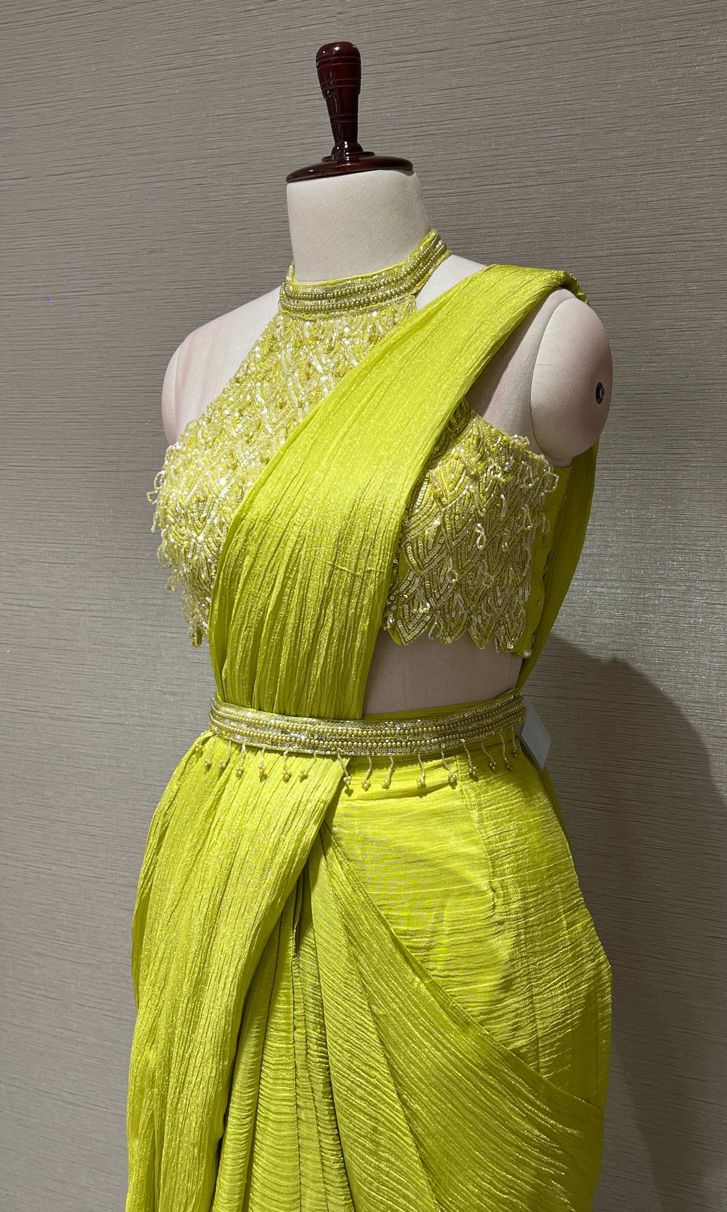 neon green drape saree with halter neck blouse