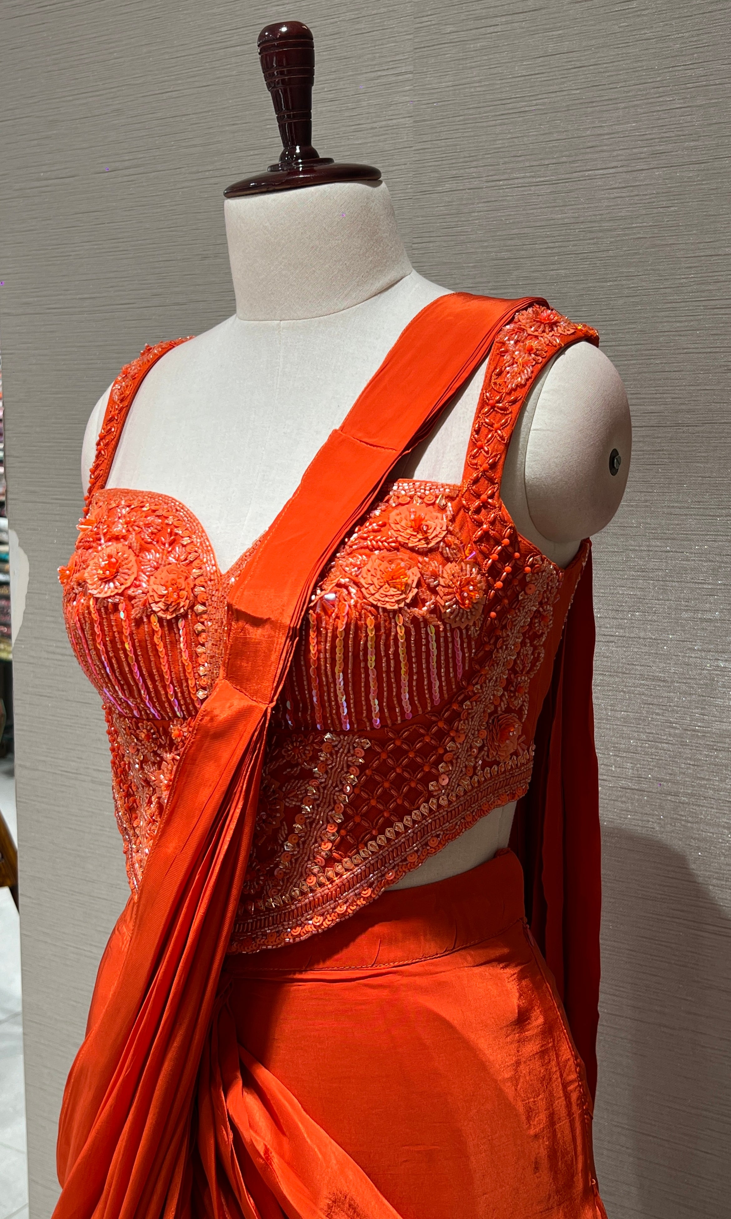 Orange drape saree with corset blouse