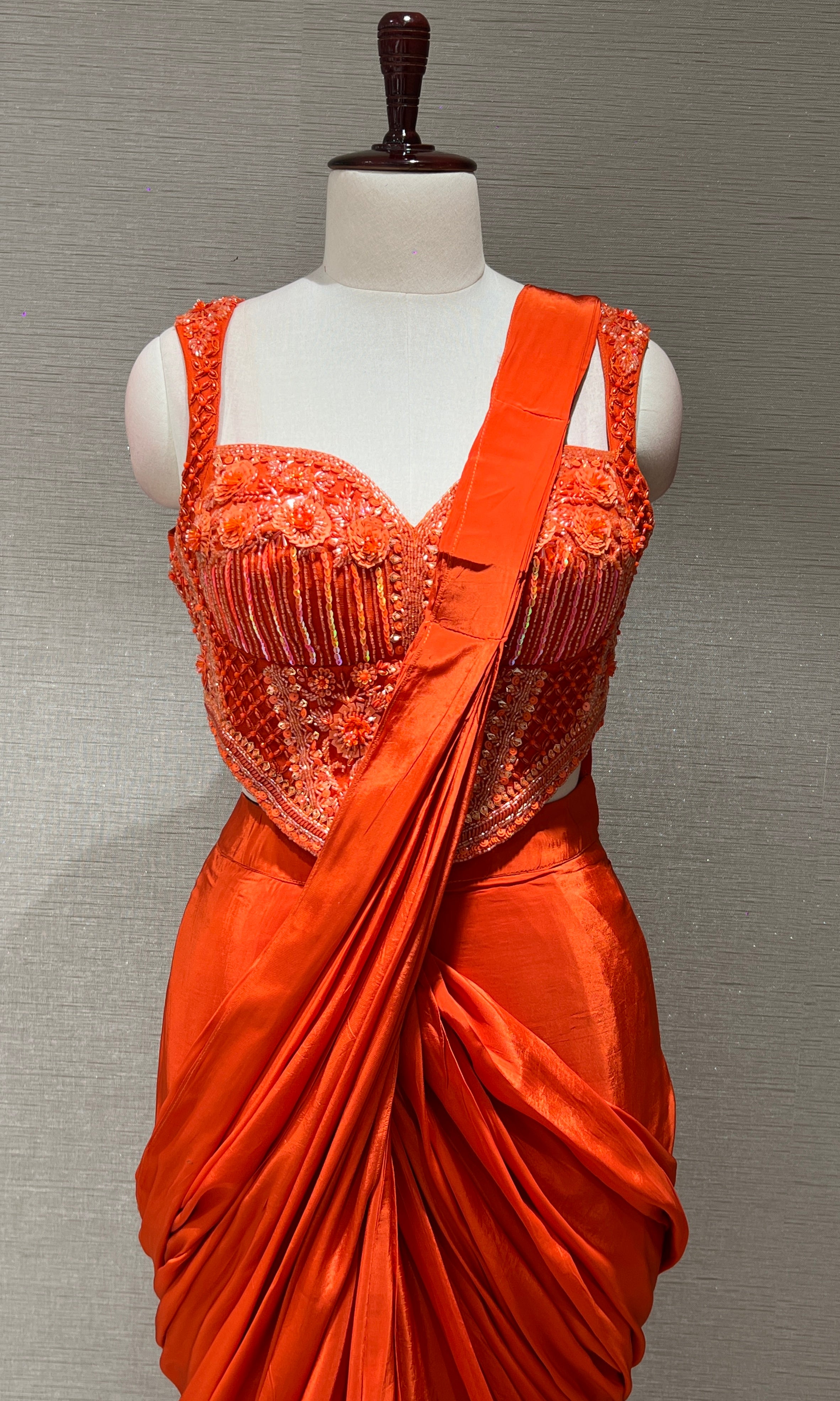 Orange drape saree with corset blouse