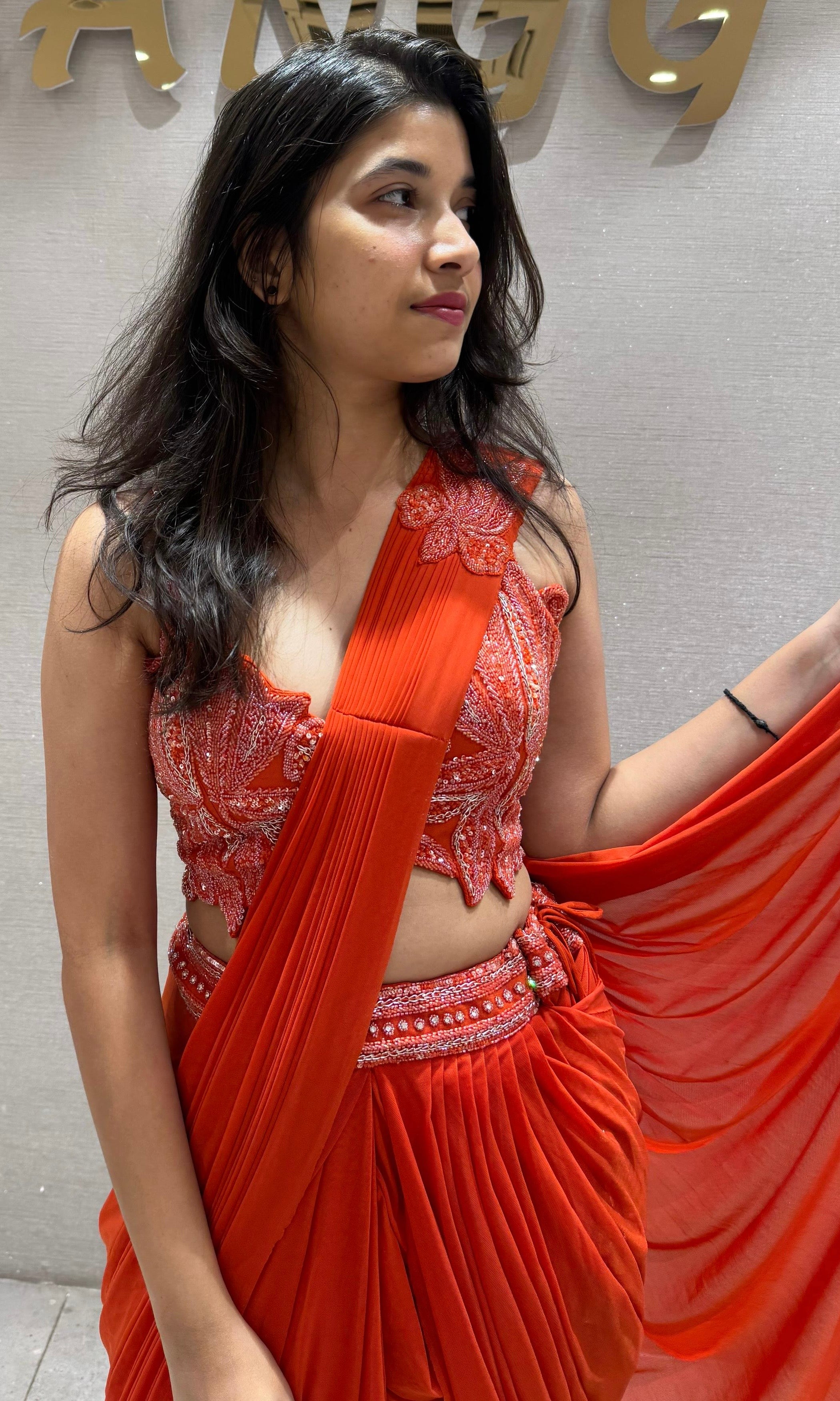 Orange drape saree with Corset Blouse