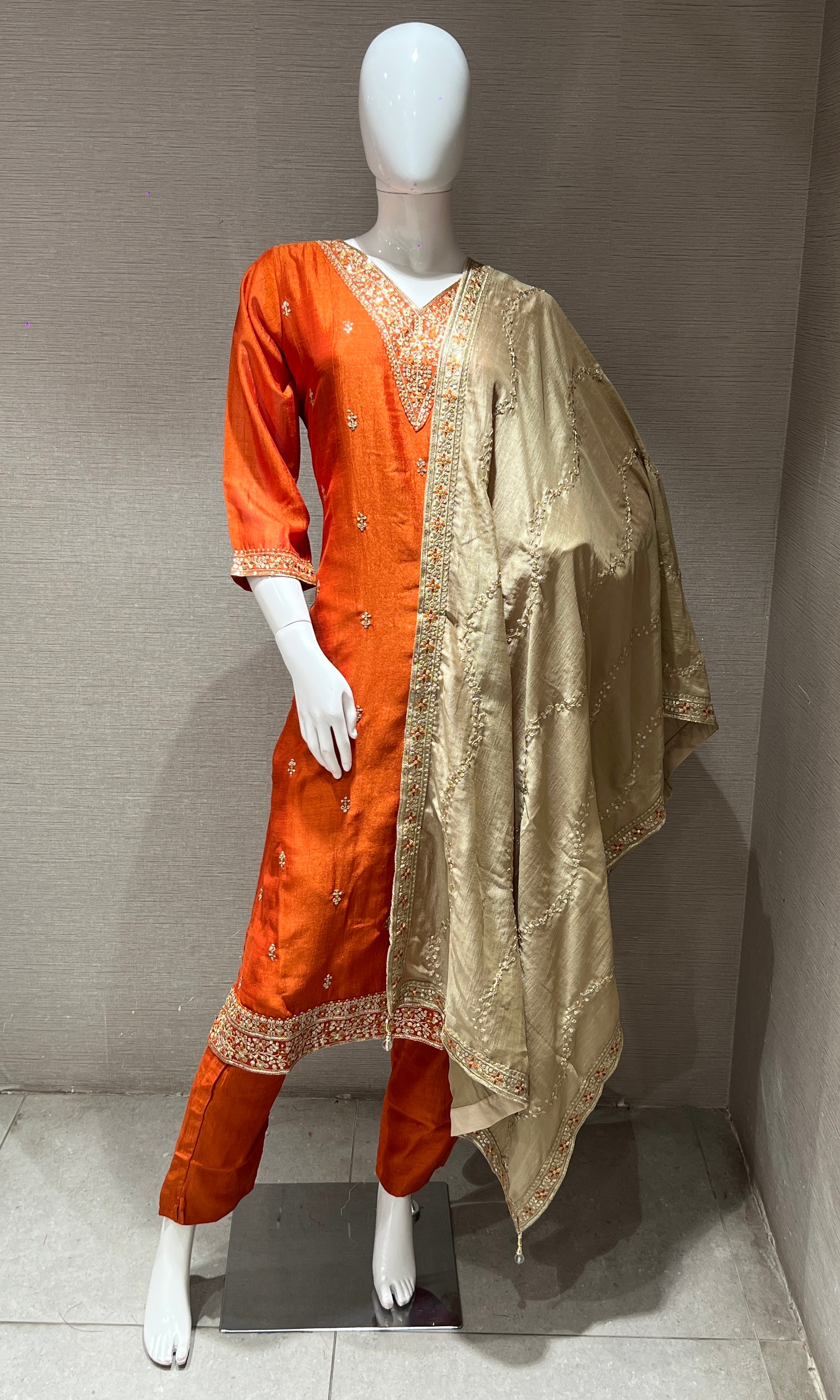 orange kurta set with contrast gold duppatta