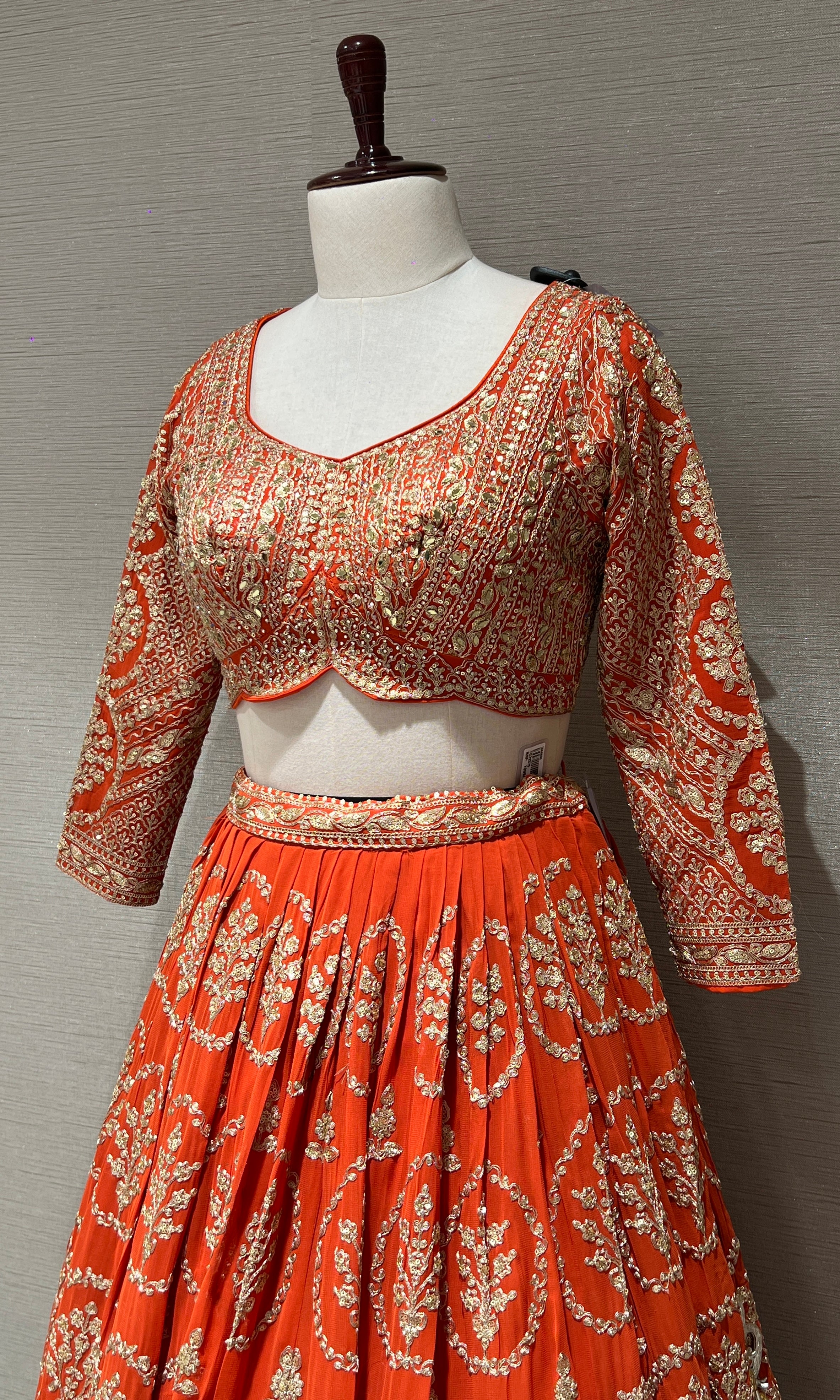 Orange Lehenga with zari and sequin gold embroidery