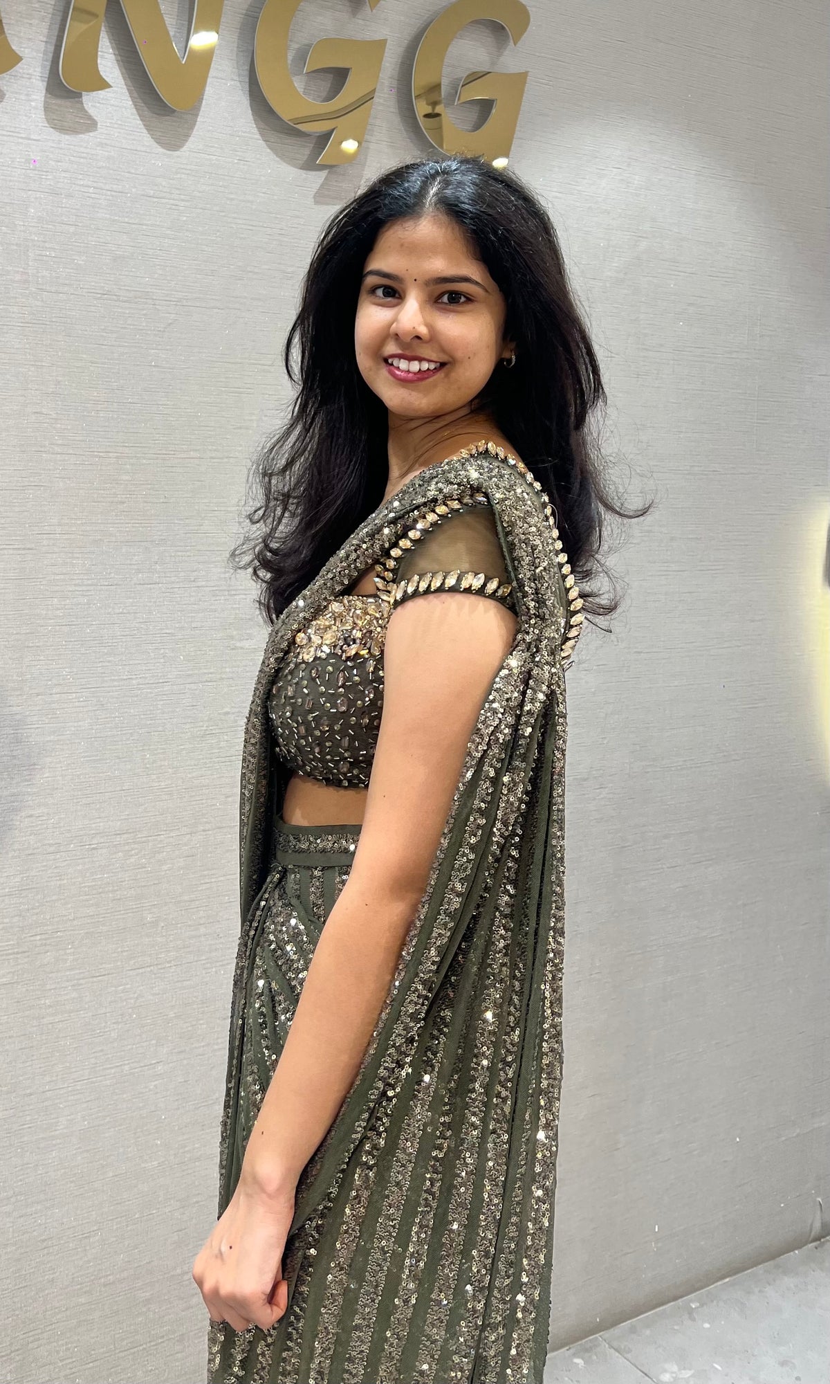 green shimmer metallic drape saree with embellished blouse