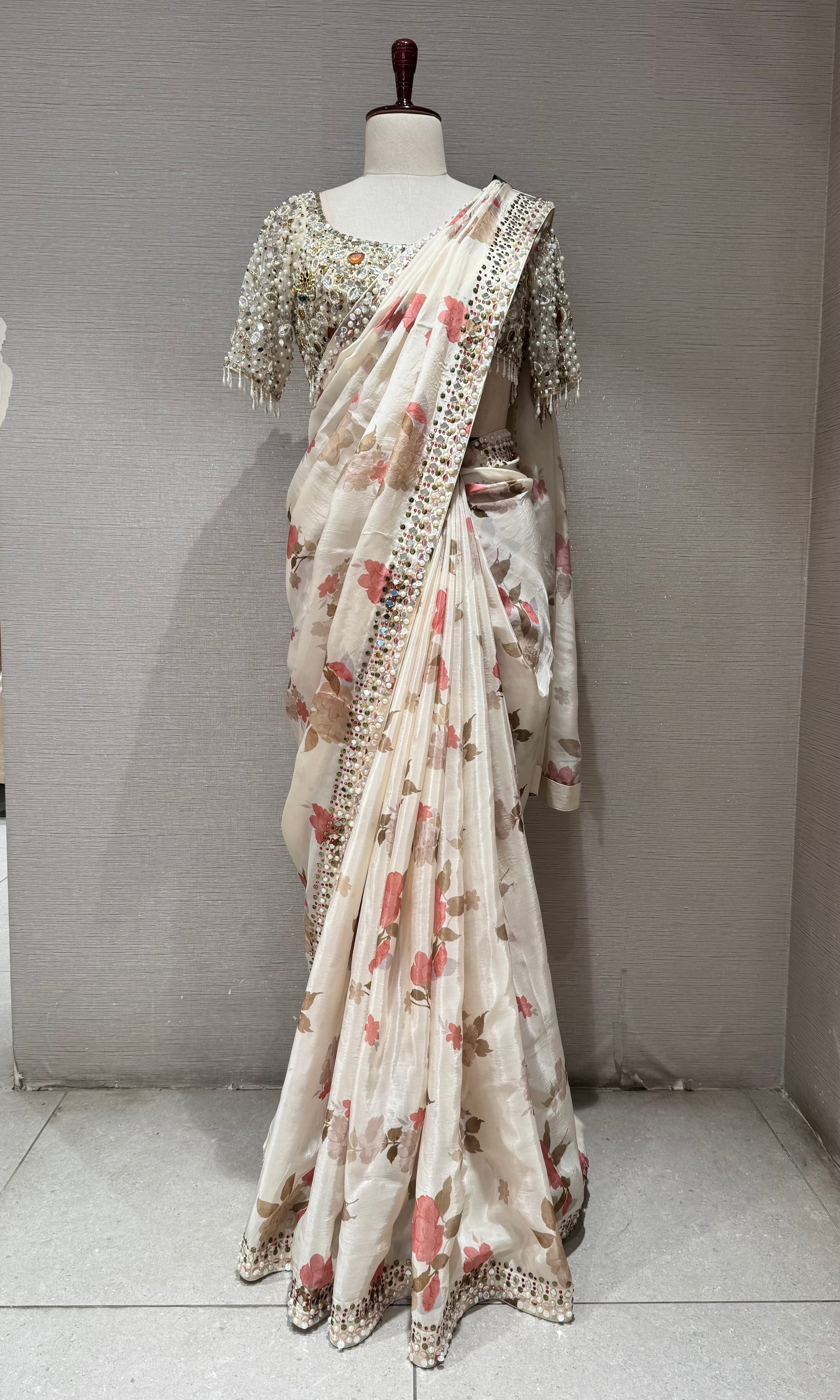 Cream elegant floral saree with embellished blouse
