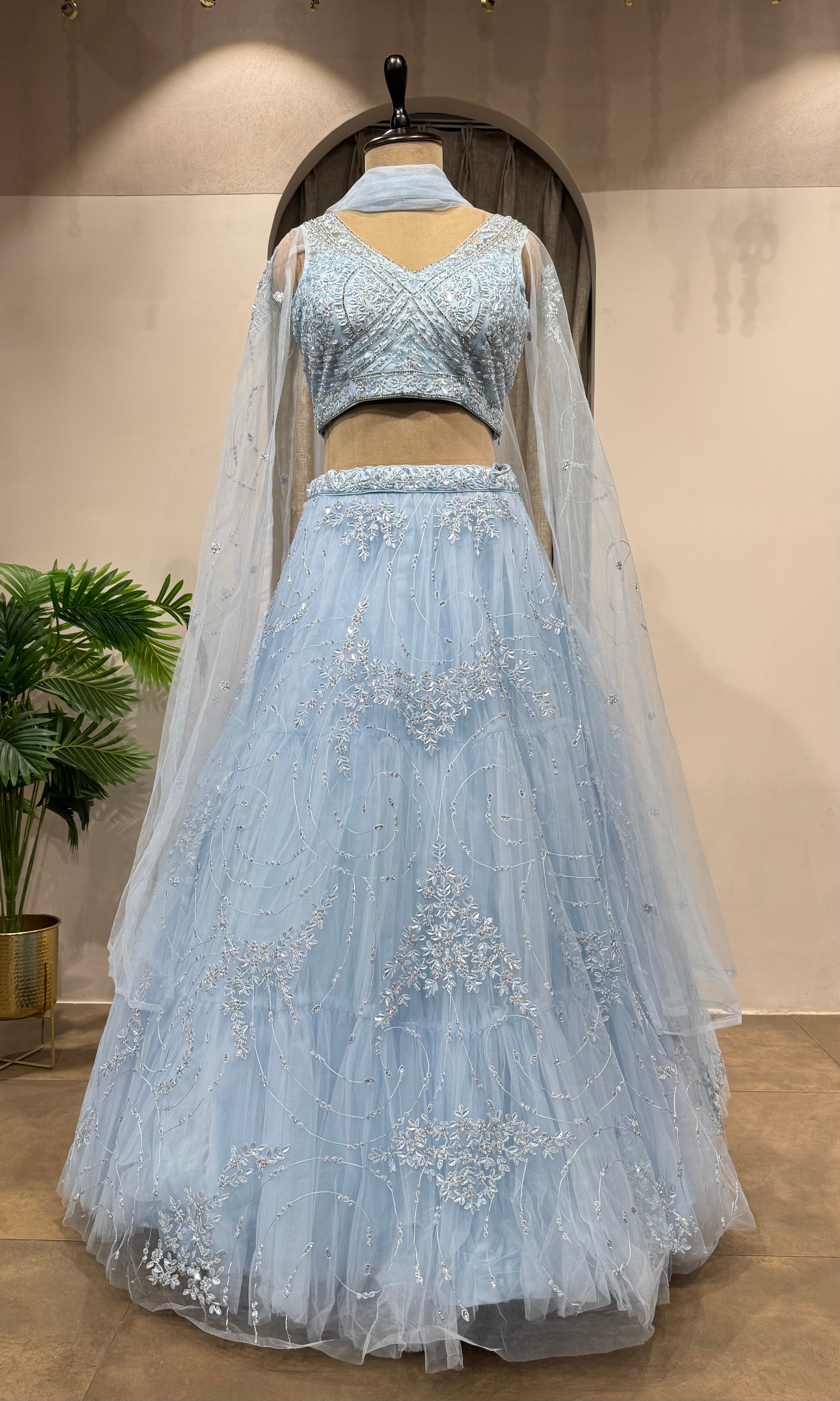 blue floral embroidered netted crop top lehenga