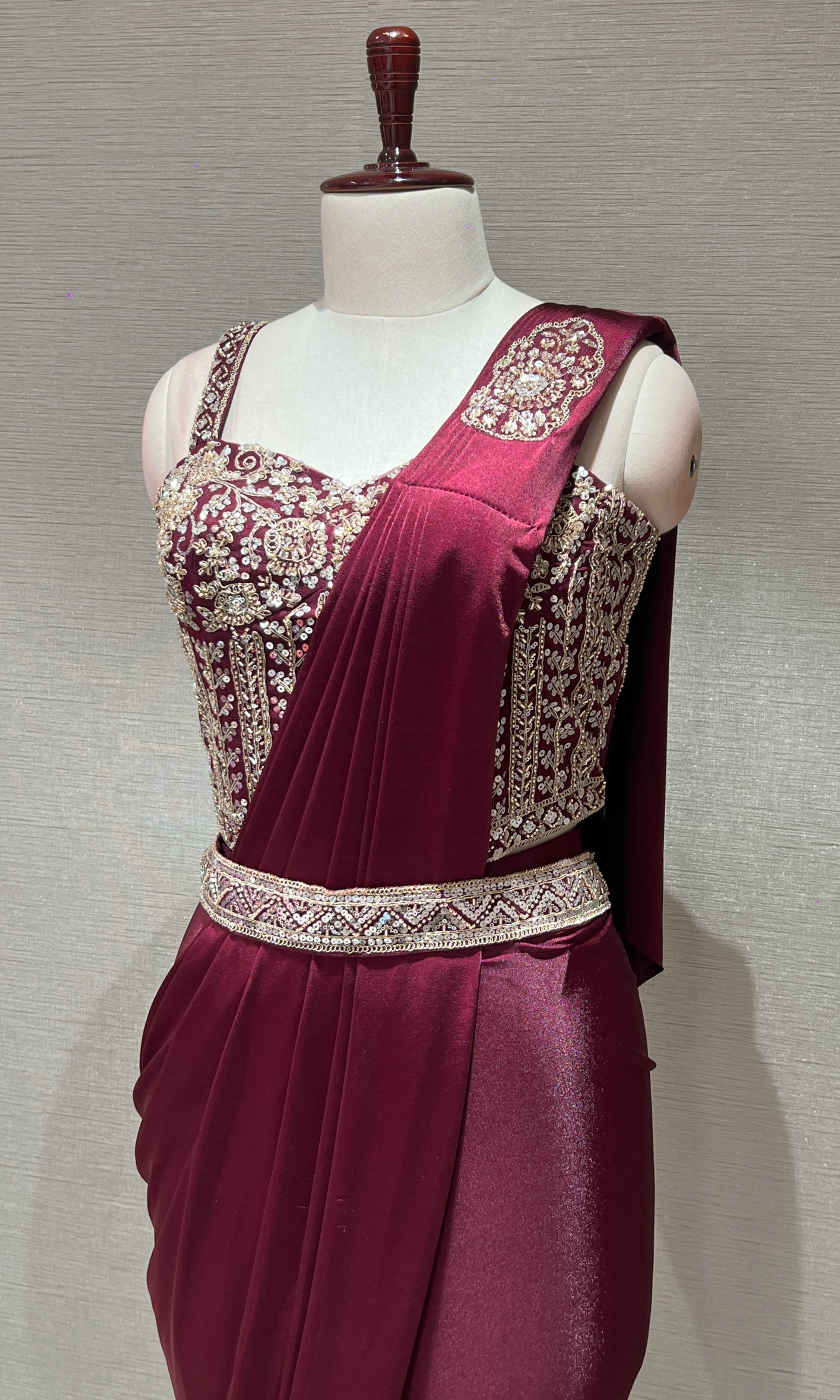 wine drape saree with corset blouse and belt
