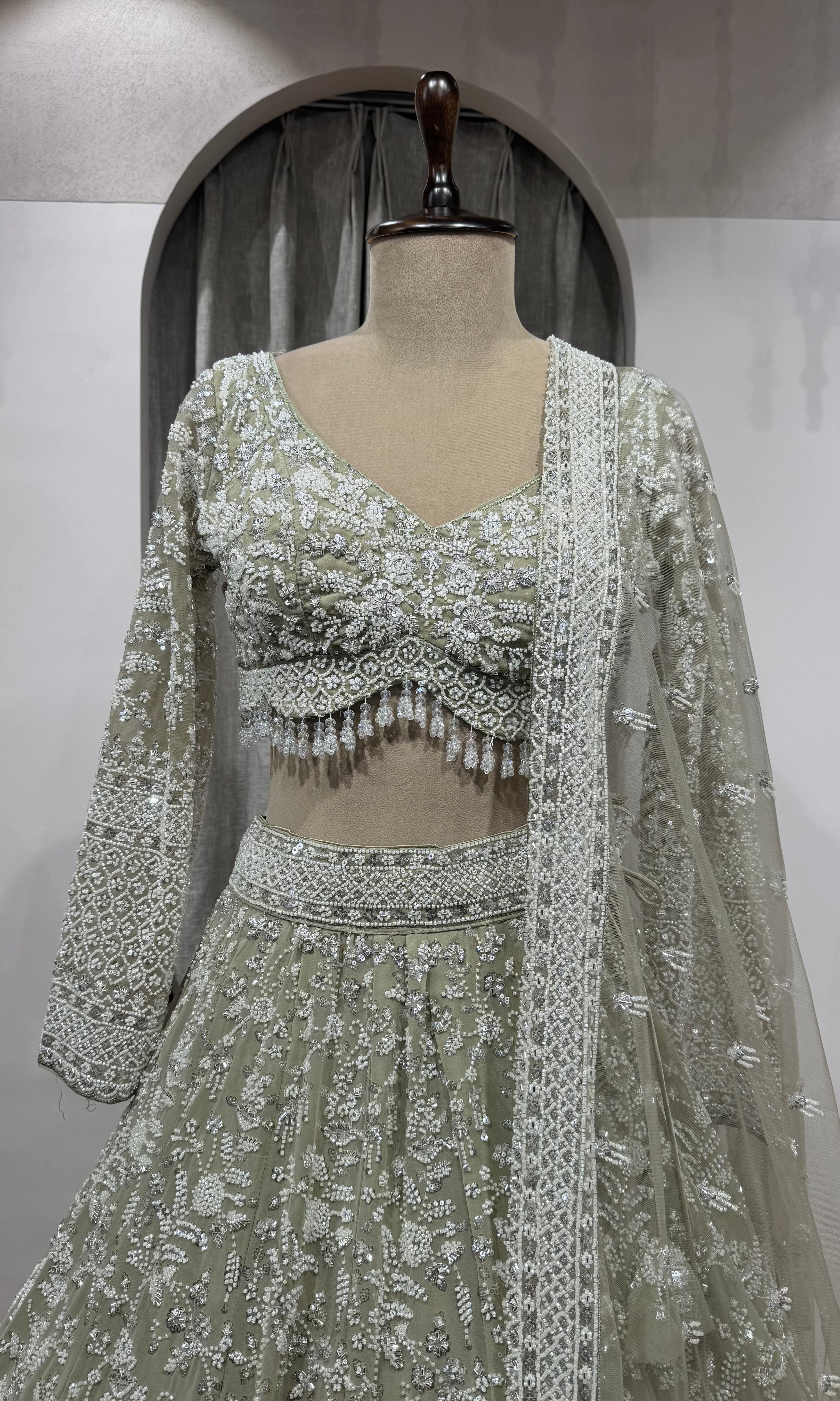 Sage Green Heavily Embroidered Net Bridal Lehenga