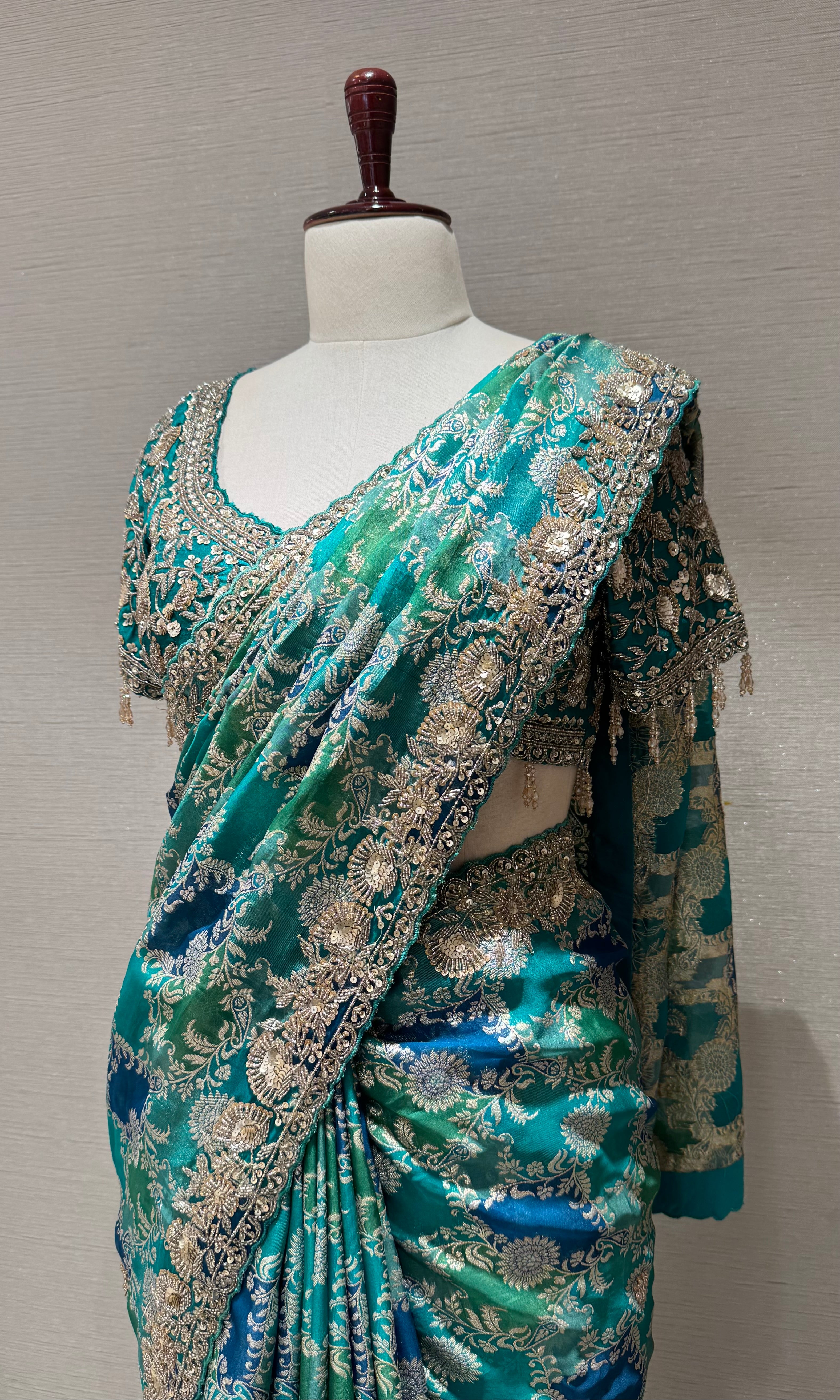 Green printed saree with an embellished Blouse