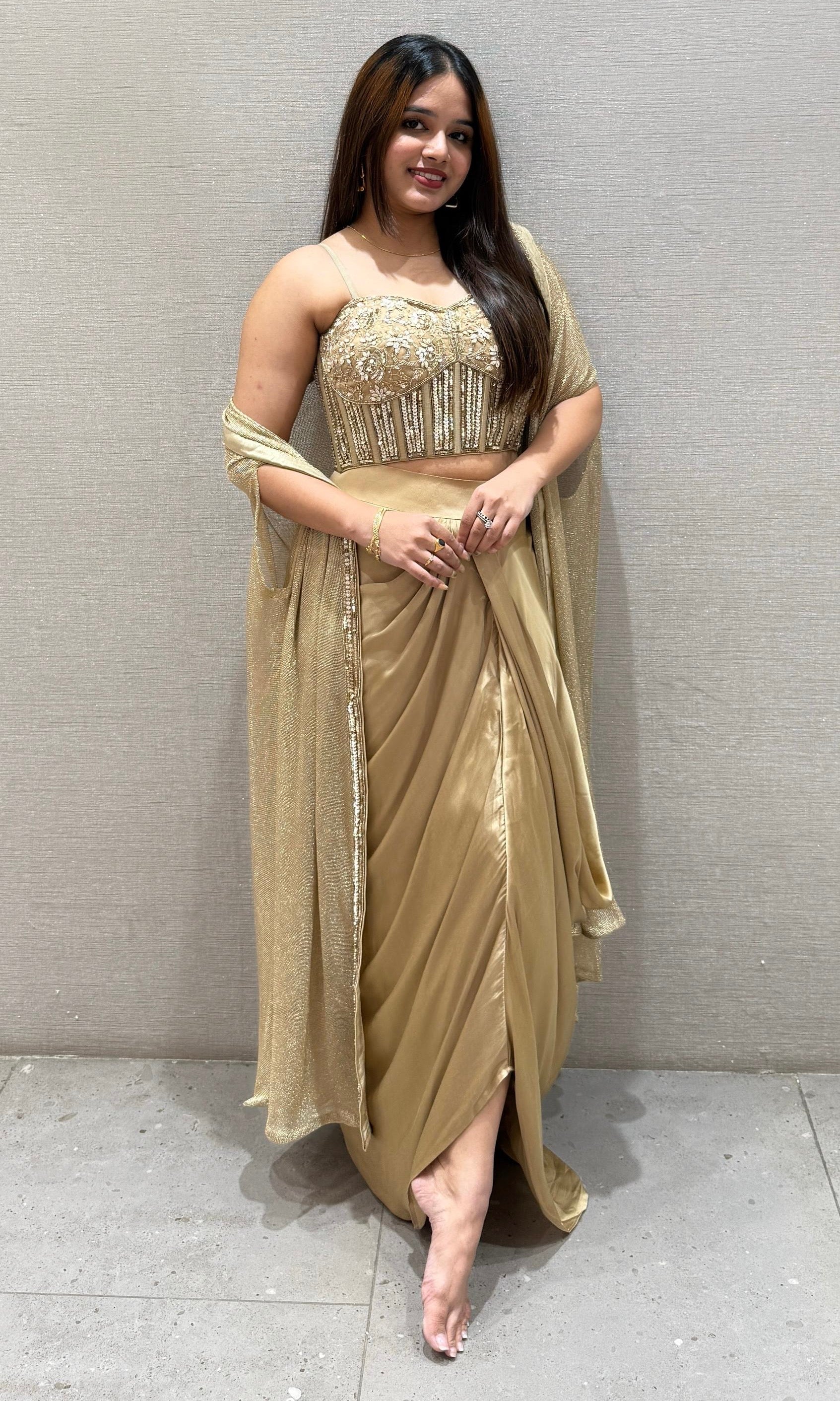 Golden sequined crop top with dhoti skirt and cape Golden sequined crop top with dhoti skirt and cape