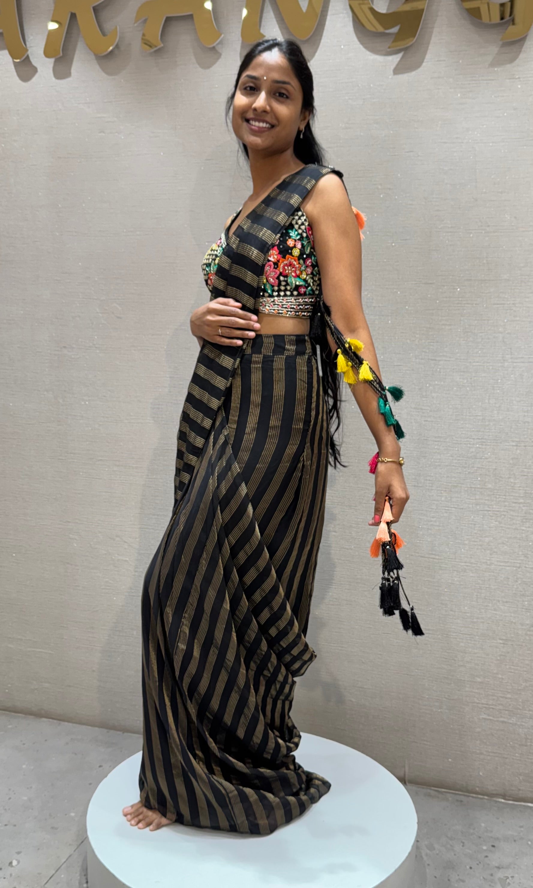 Black and silver striped drape saree with intricate blouse