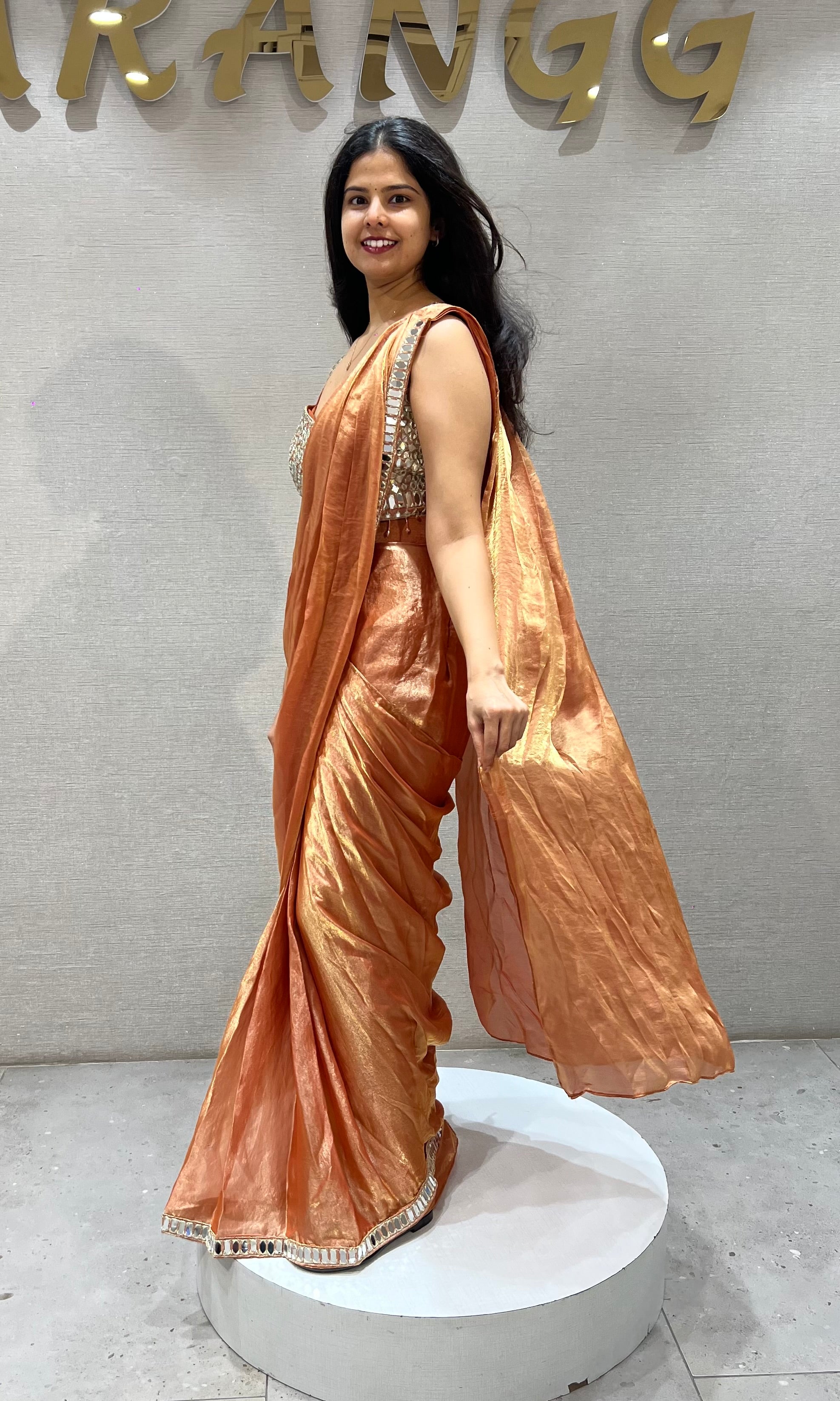 Rust Shimmer Drape Saree with mirror embellished blouse