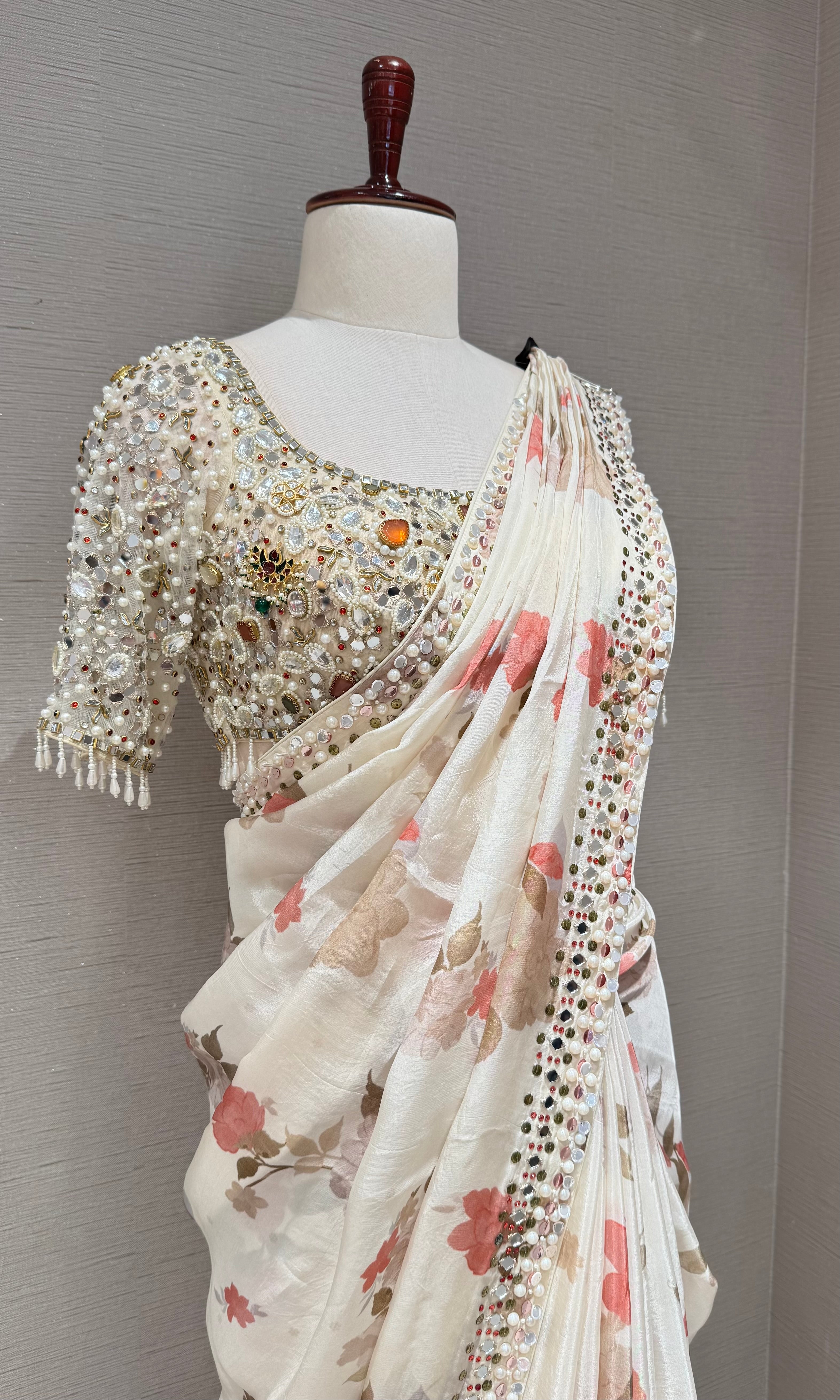 Cream elegant floral saree with embellished blouse