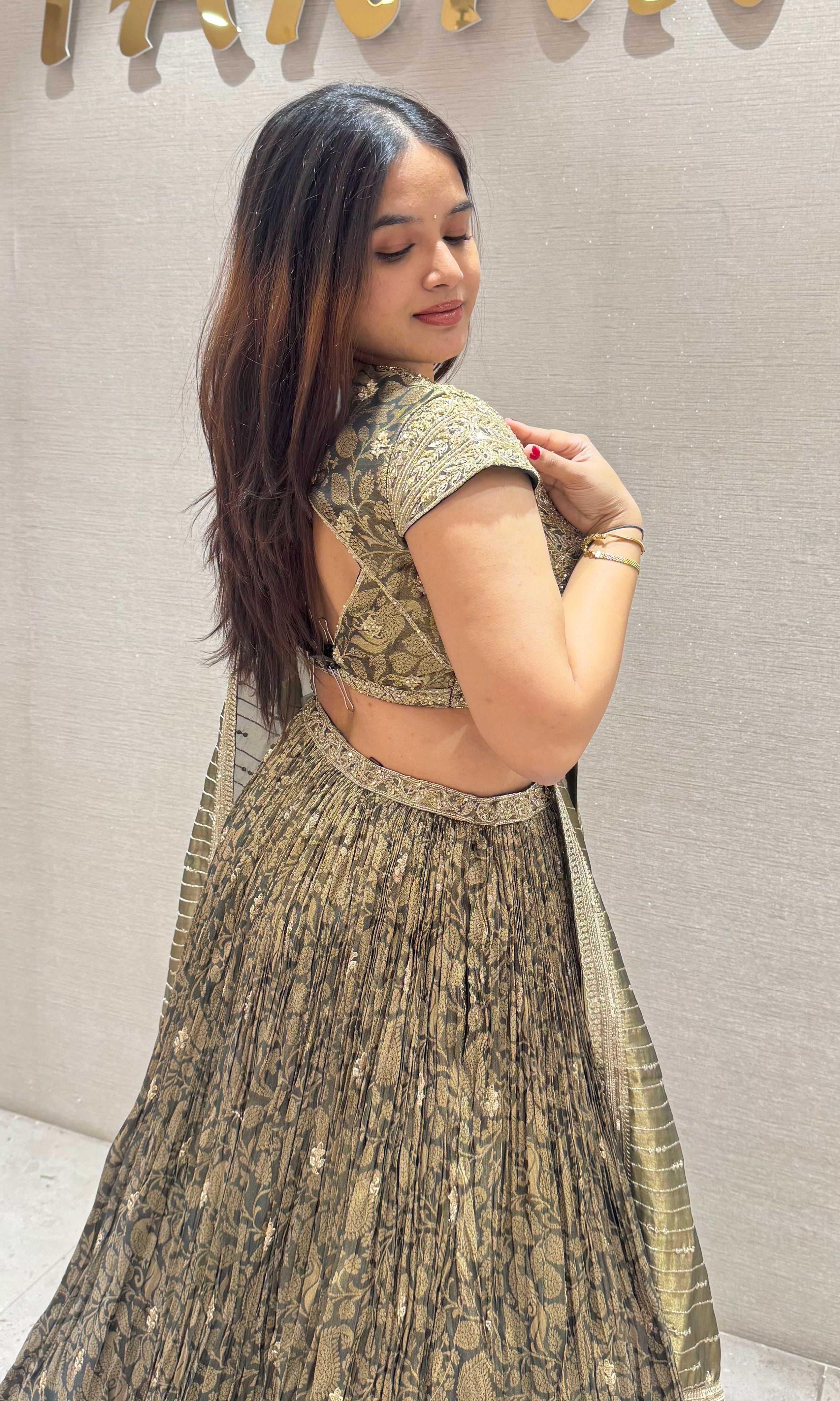 Emerald green crushed lehenga with tissue gold