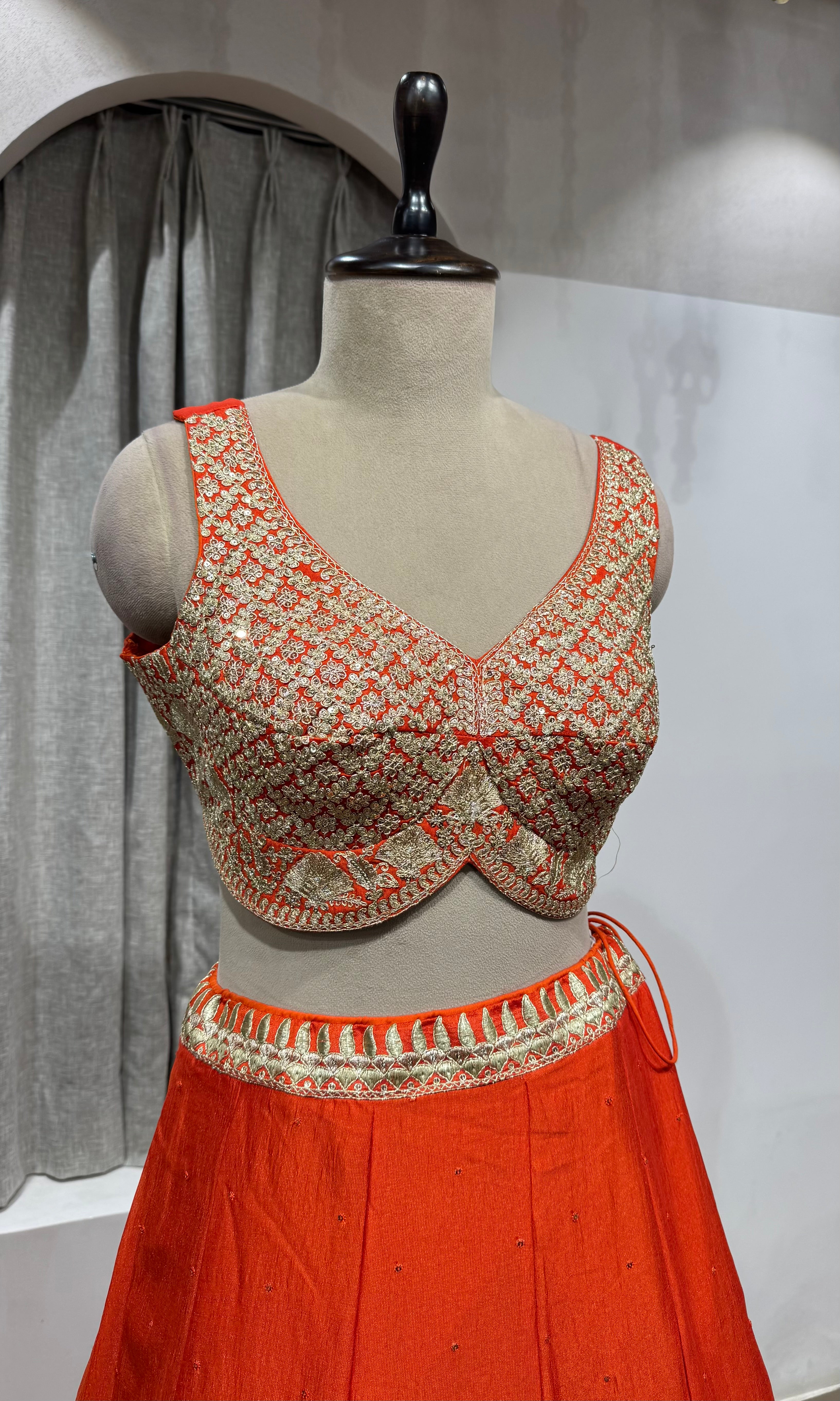 ORANGE LEHENGA WITH GOLDEN EMBROIDERY