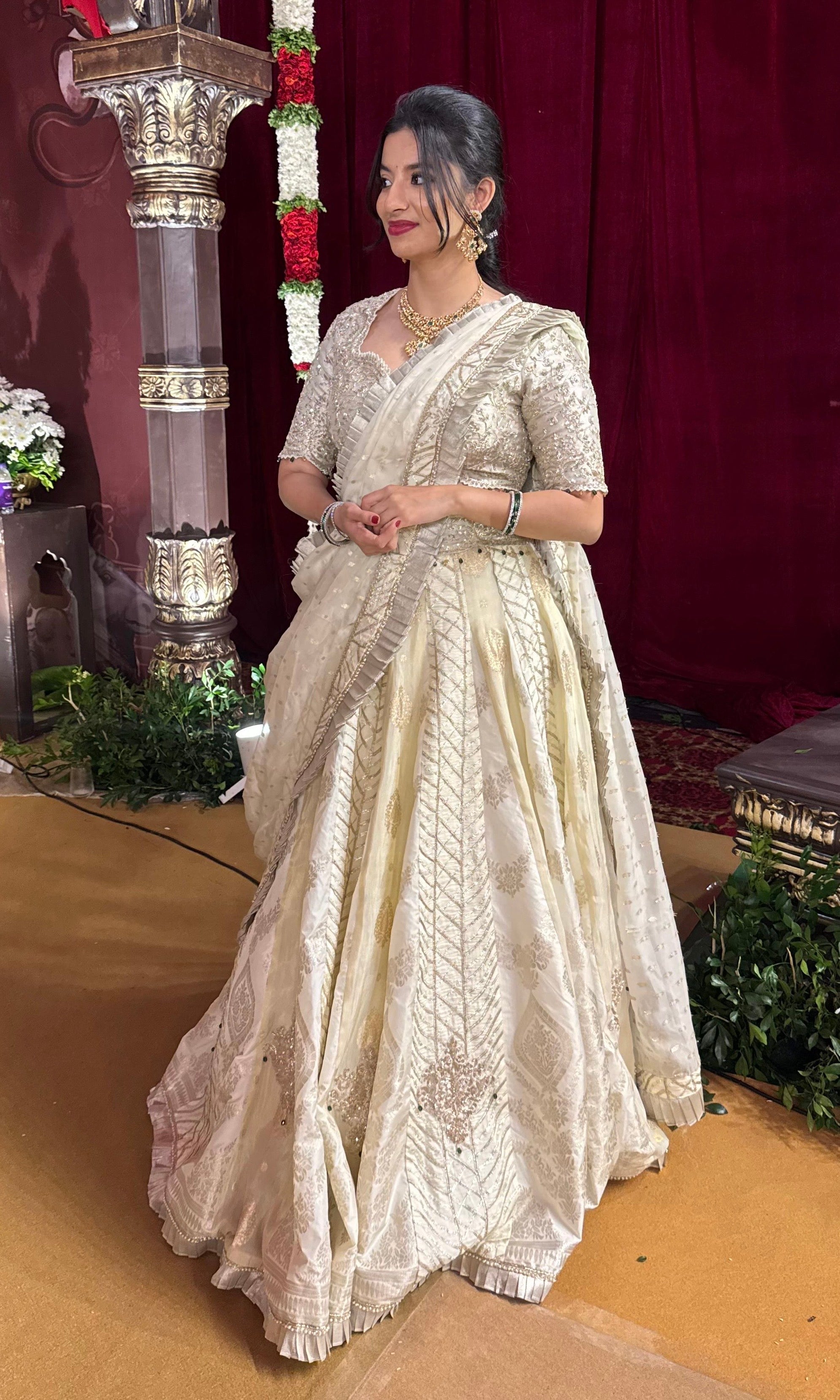 Ivory white gold lehenga with emerald greed beads