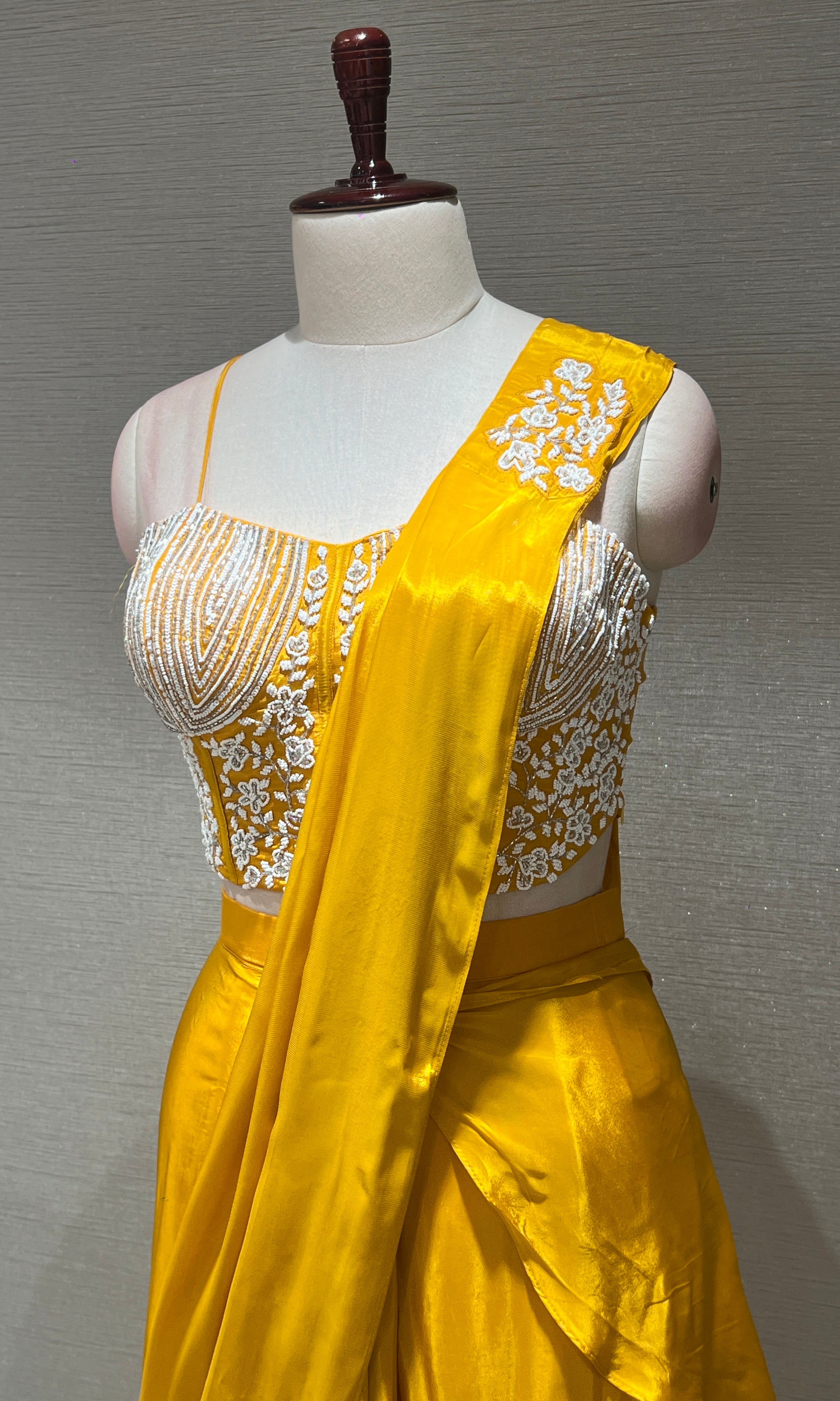 Yellow drape saree with Corset blouse