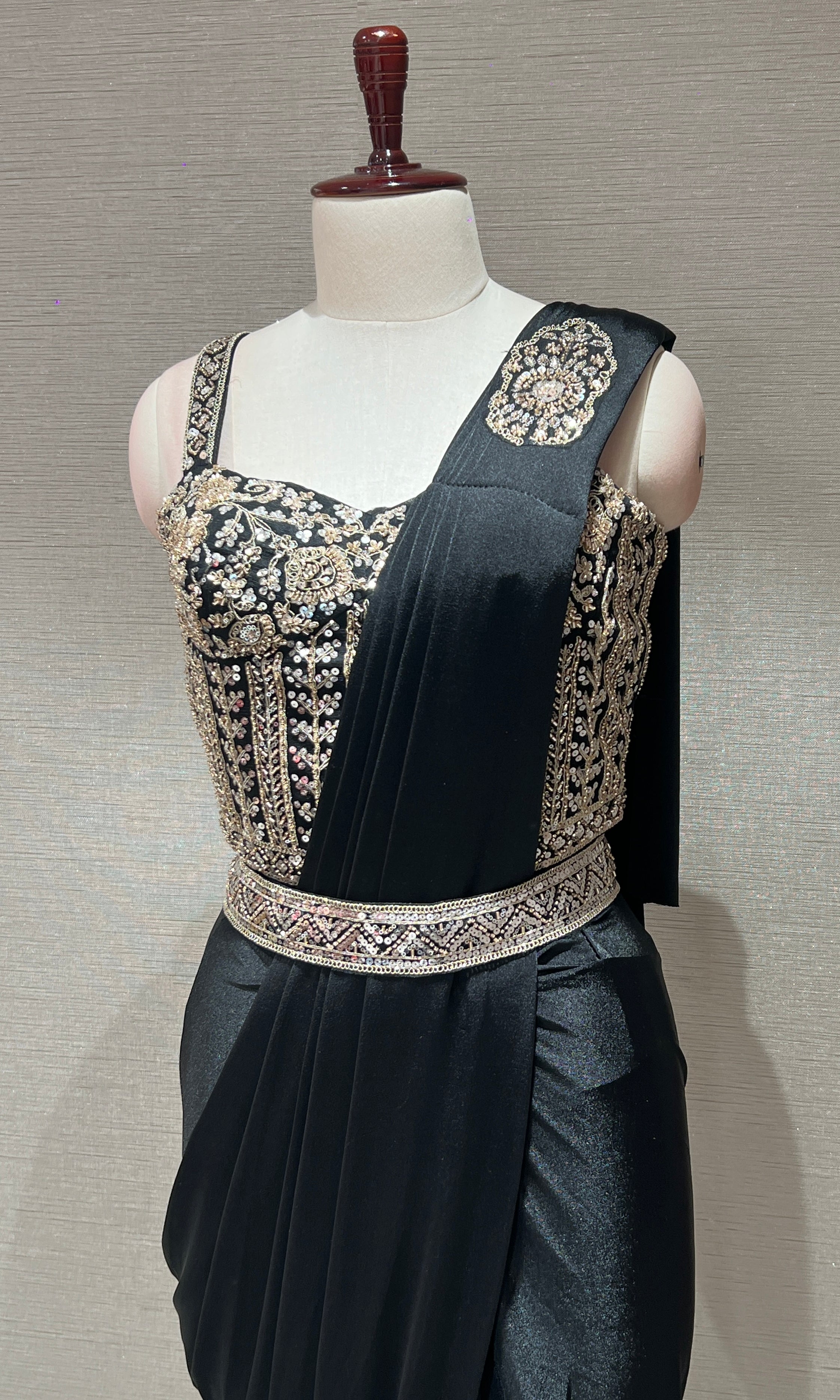 black drape saree with corset blouse and belt