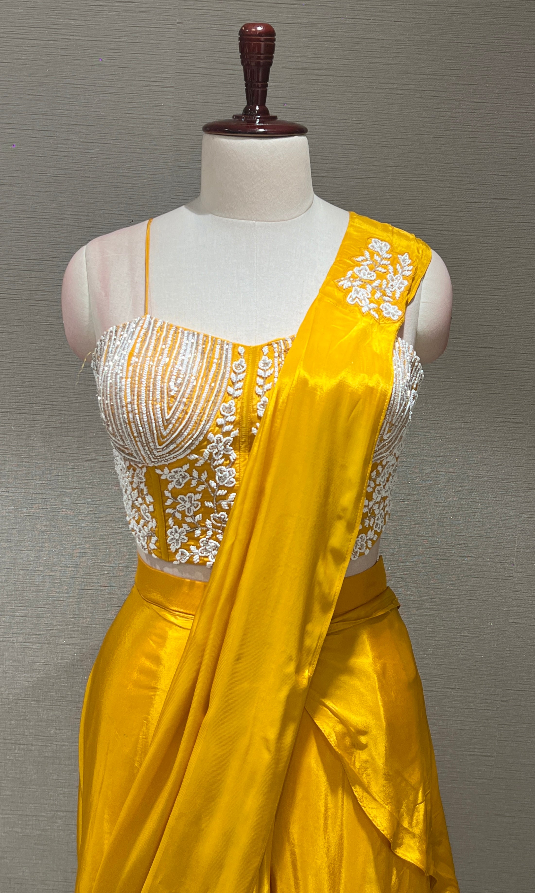 Yellow drape saree with Corset blouse