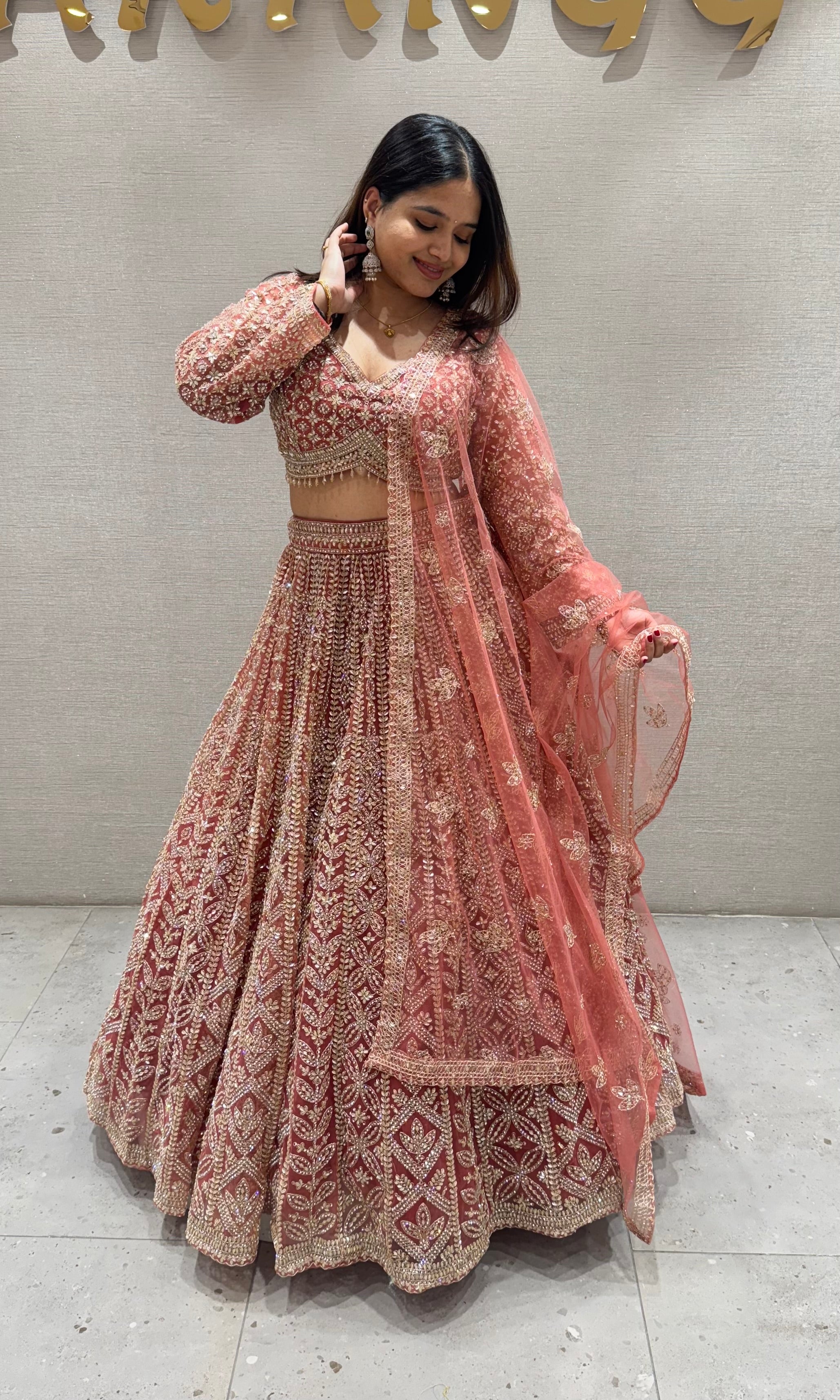 Peachy Orange lehenga with stone work