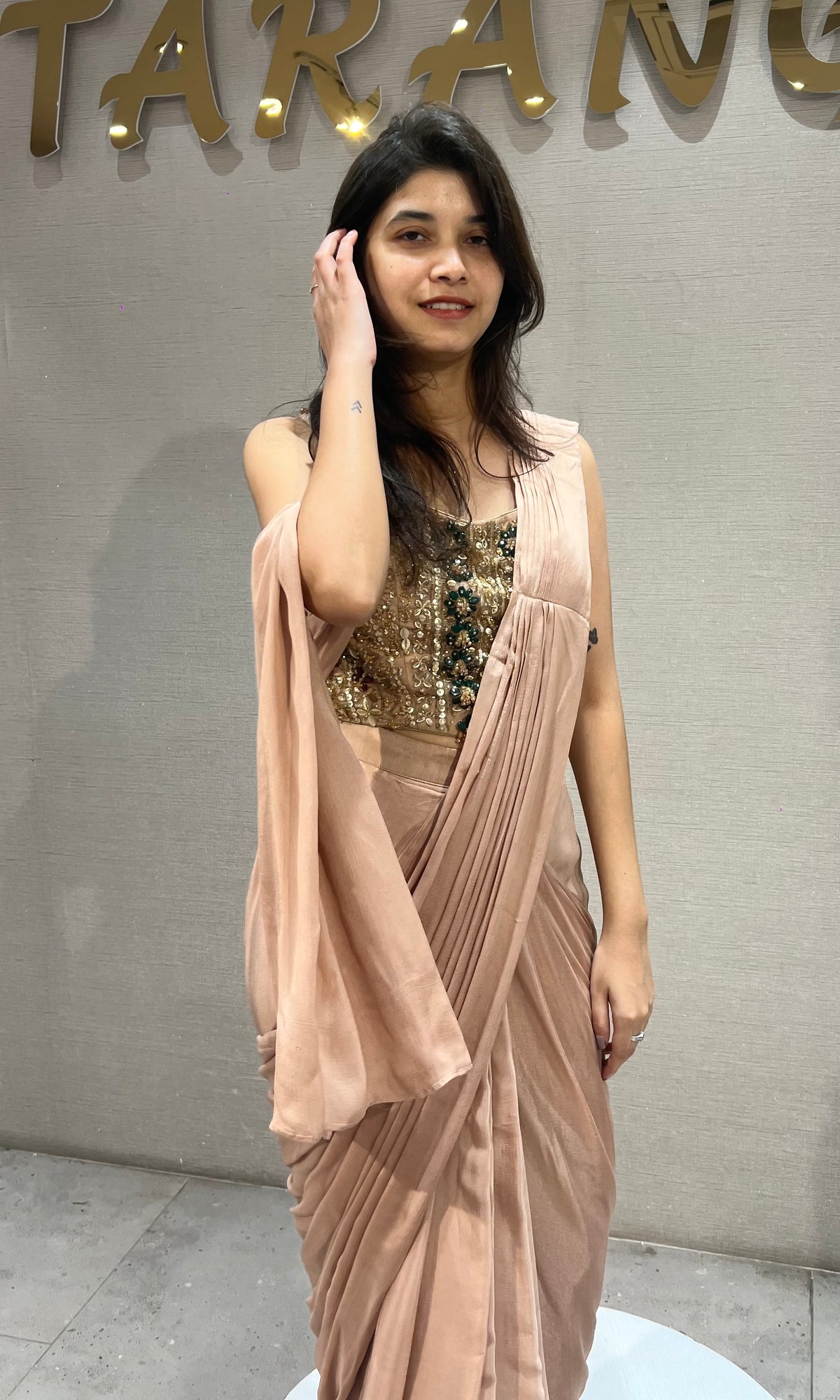 Dusty Georgette drape saree with gold & emerald green detailing blouse