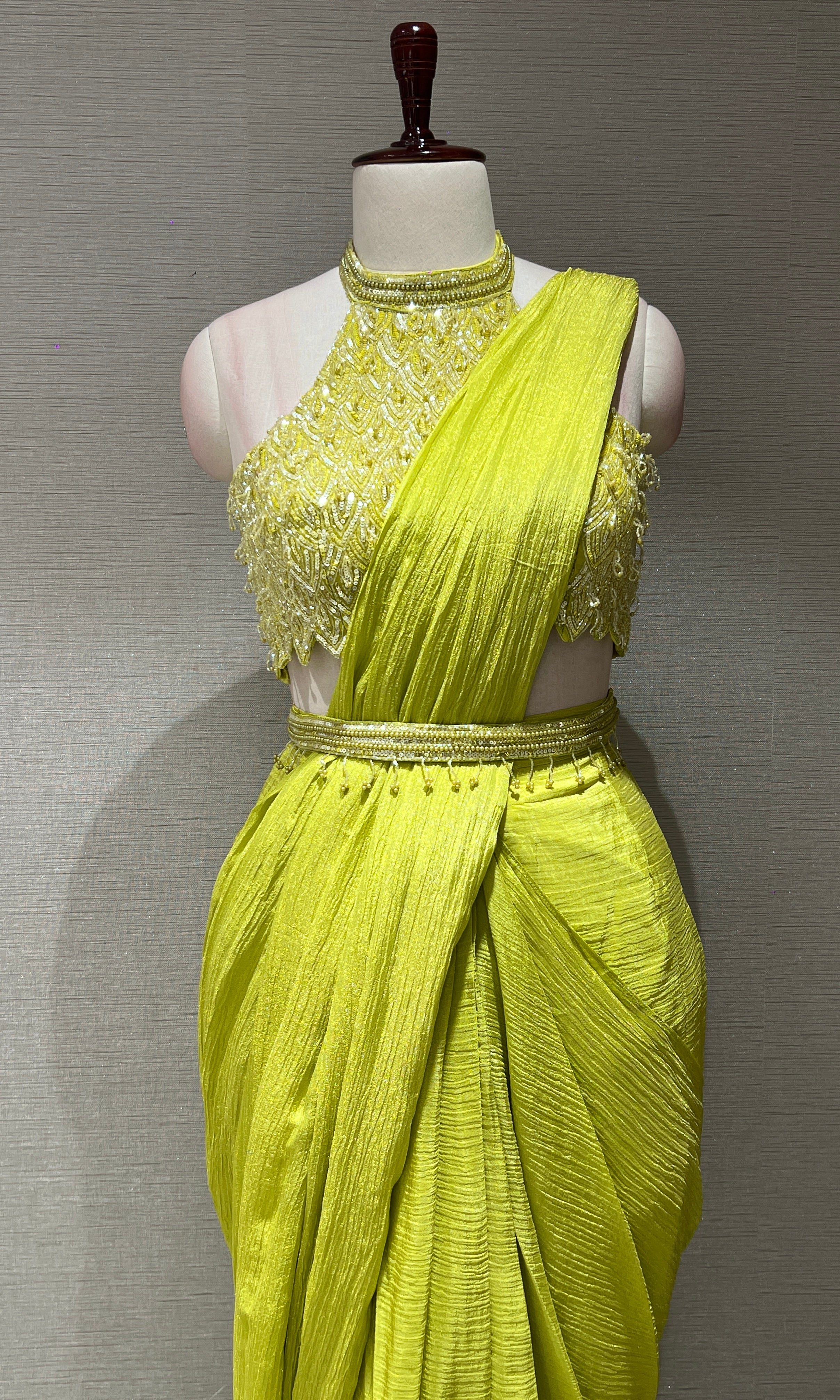 neon green drape saree with halter neck blouse